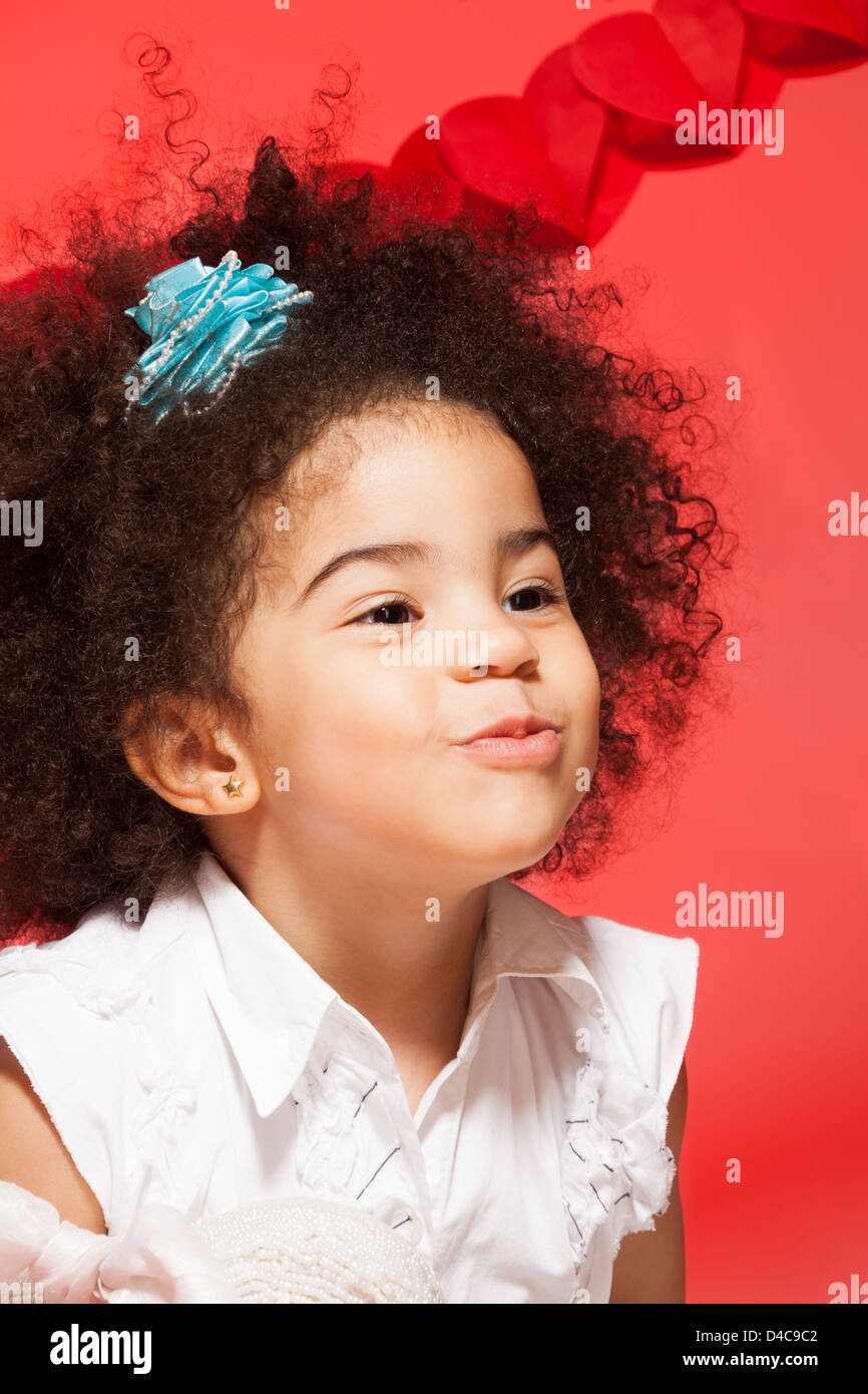 Kissing Little Black Curly Girl On Red Valentine Day Background