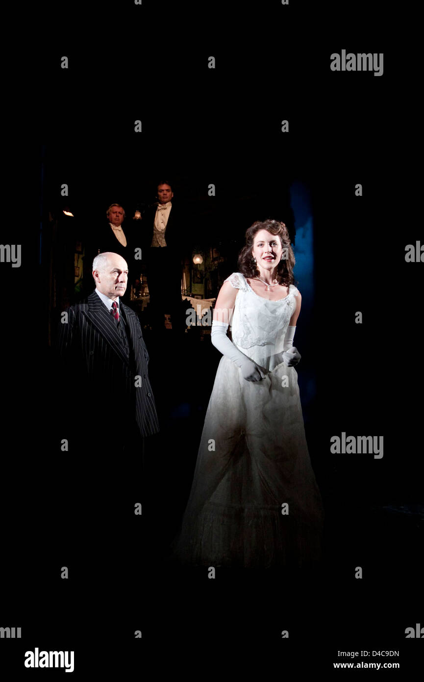 front: Nicholas Woodeson (Inspector Goole), Marianne Oldham (Sheila Birling) rear, l-r: David Roper (Arthur Birling), Timothy Watson (Gerald Croft) in AN INSPECTOR CALLS by J B Priestley at the Novello Theatre, London WC2 25/09/2009 a National Theatre production  design: Ian MacNeil   lighting: Rick Fisher   director: Stephen Daldry Stock Photo