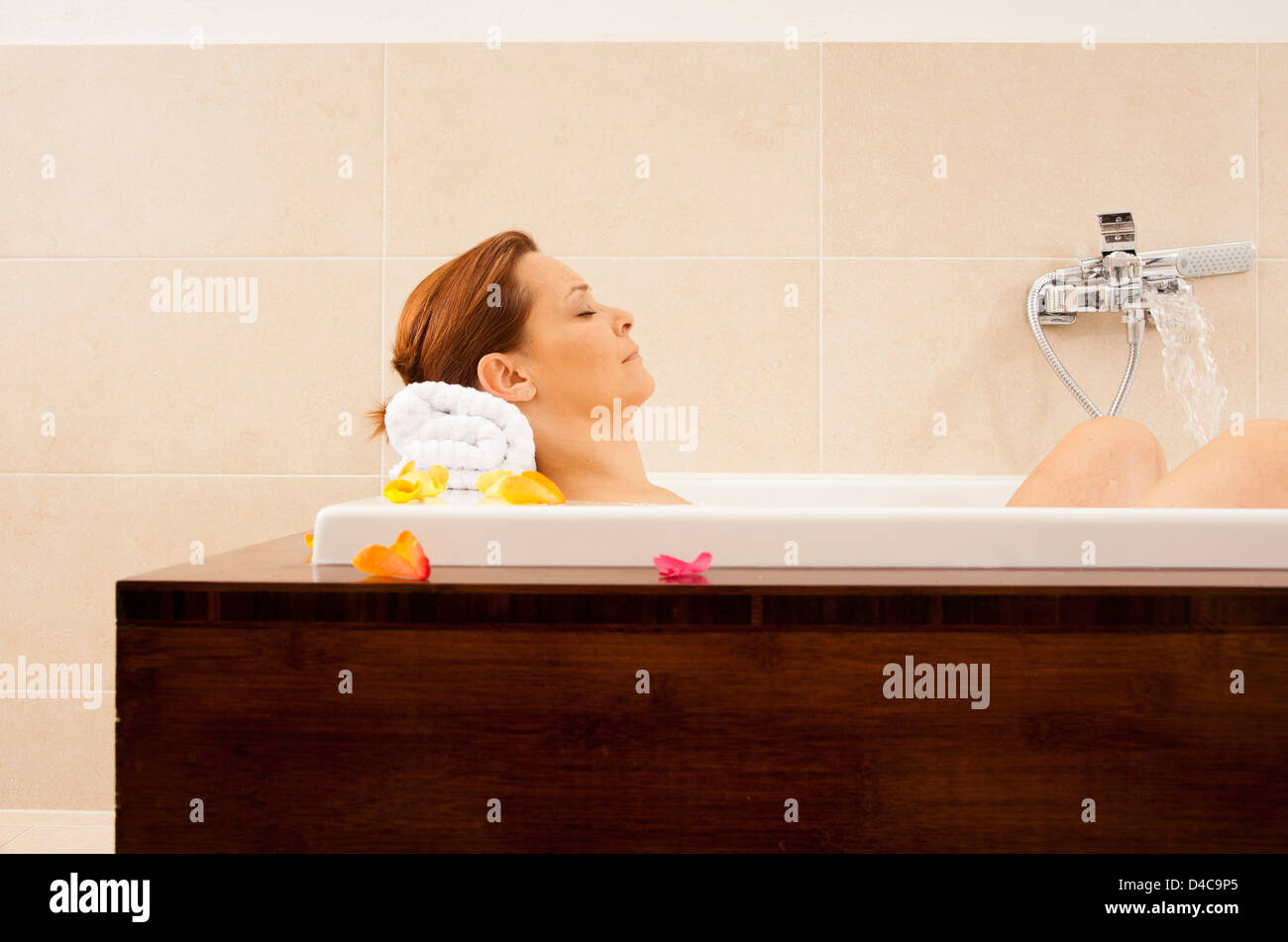 Woman taking a bath Stock Photo