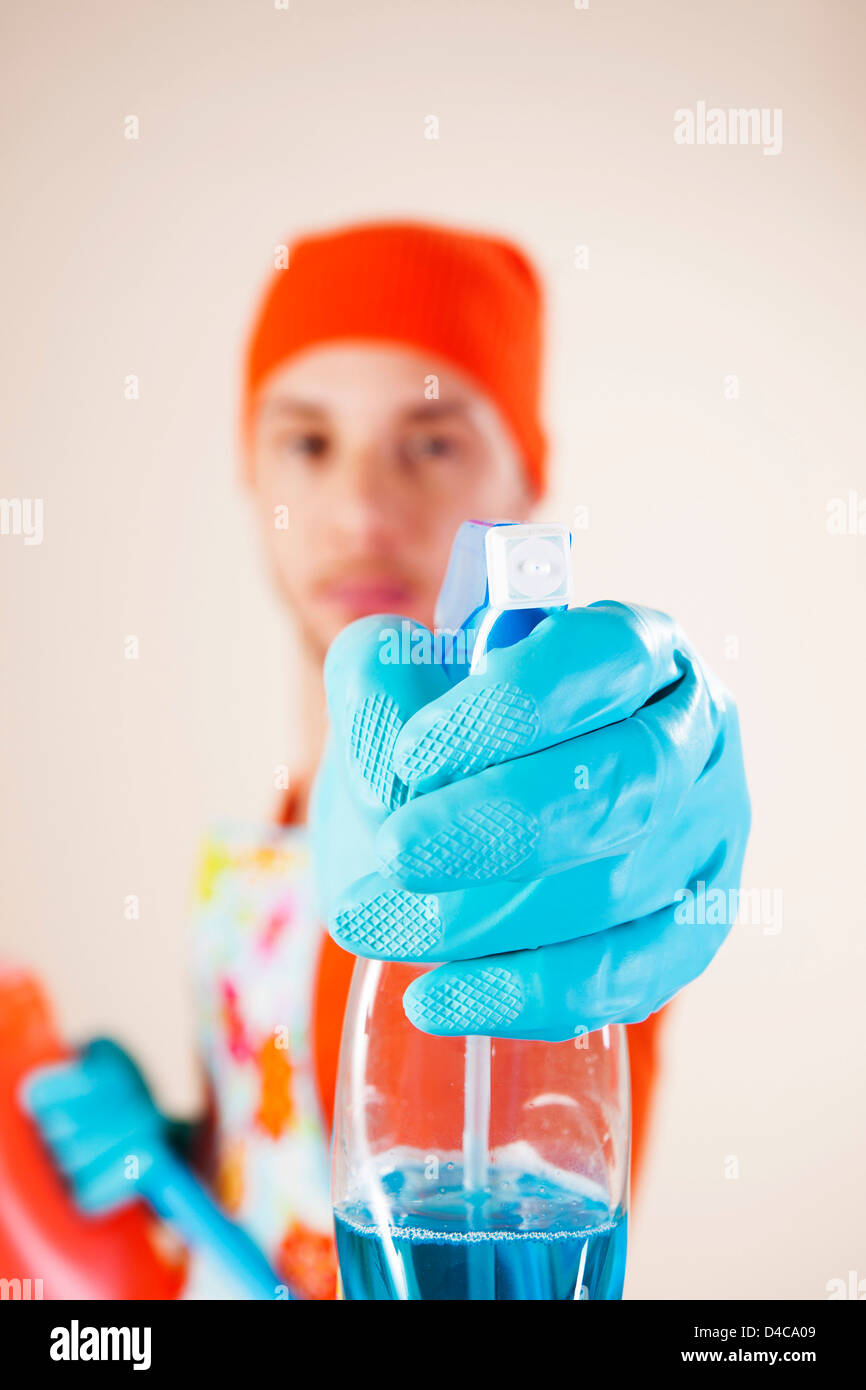 Young man housecleaning Stock Photo