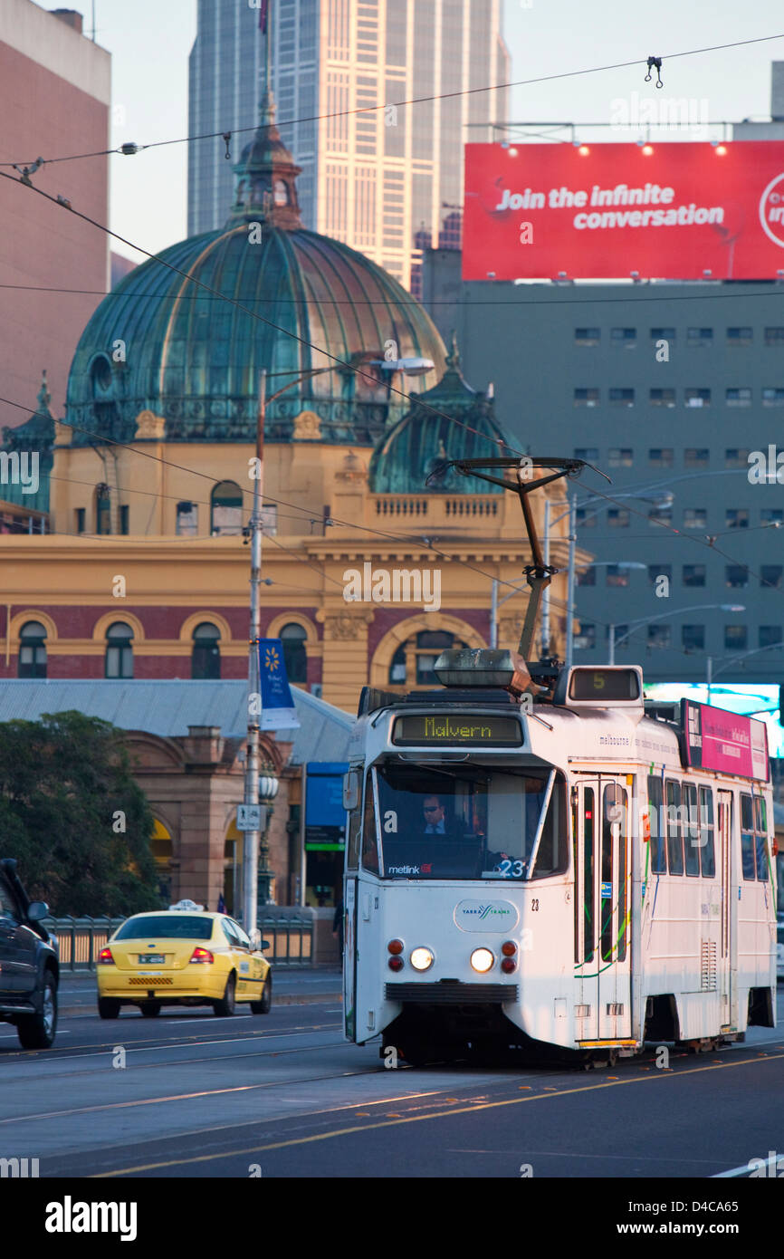 Tram on St Kilda Road with Flinders Street Station and city skyline in background. Melbourne, Victoria, Australia Stock Photo