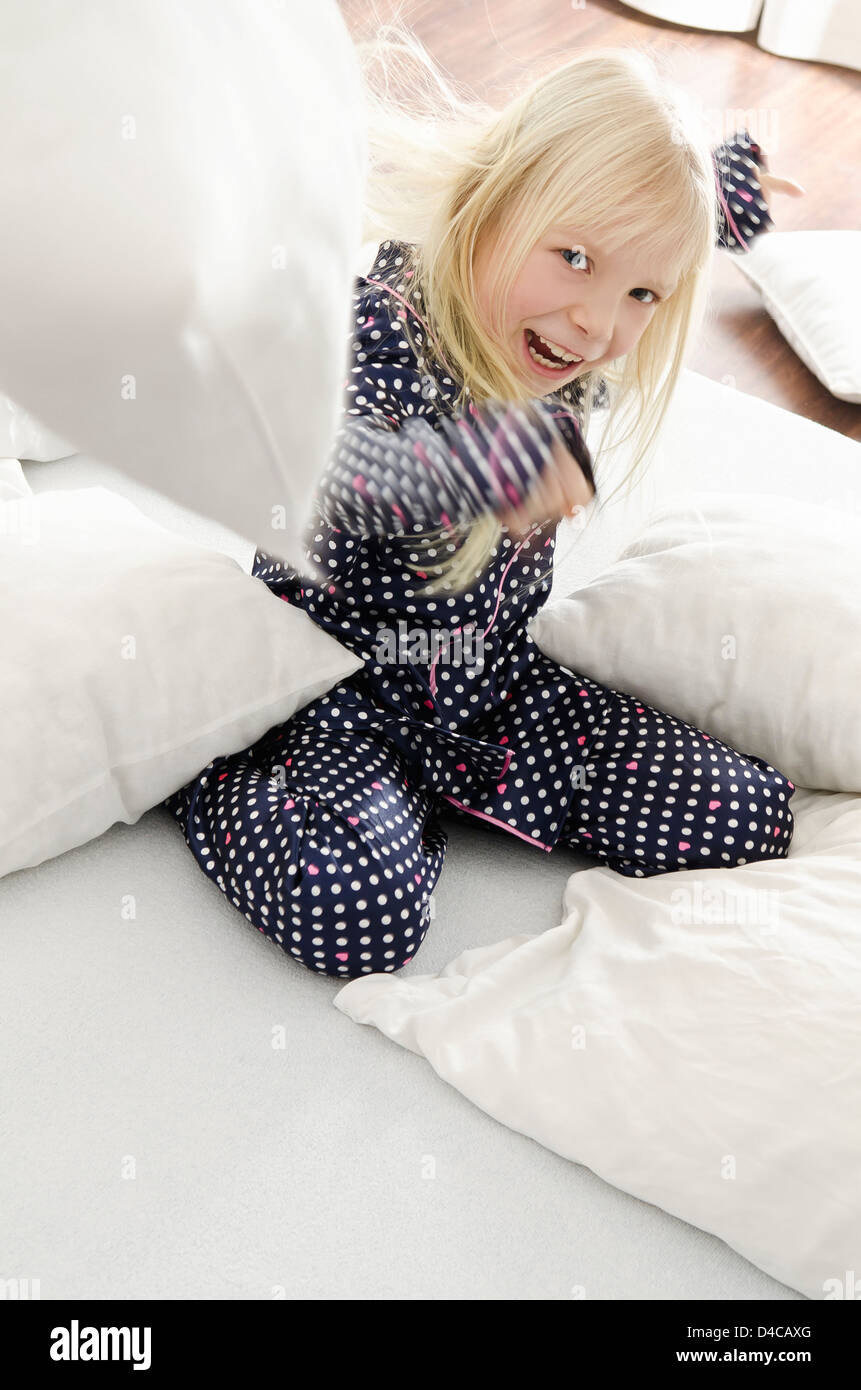 Girl doing pillow fight Stock Photo Alamy
