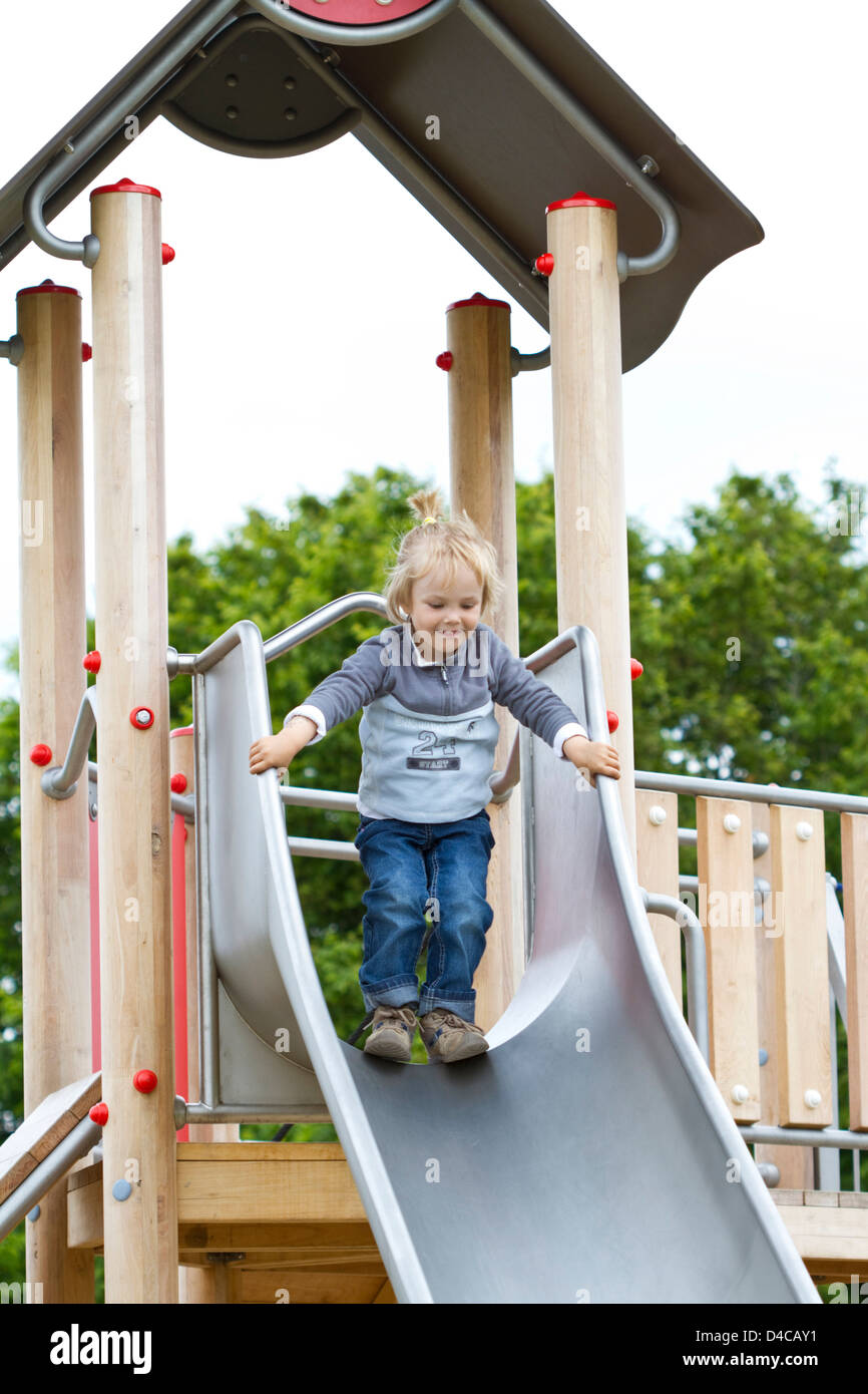 Toddler on a slide Stock Photo