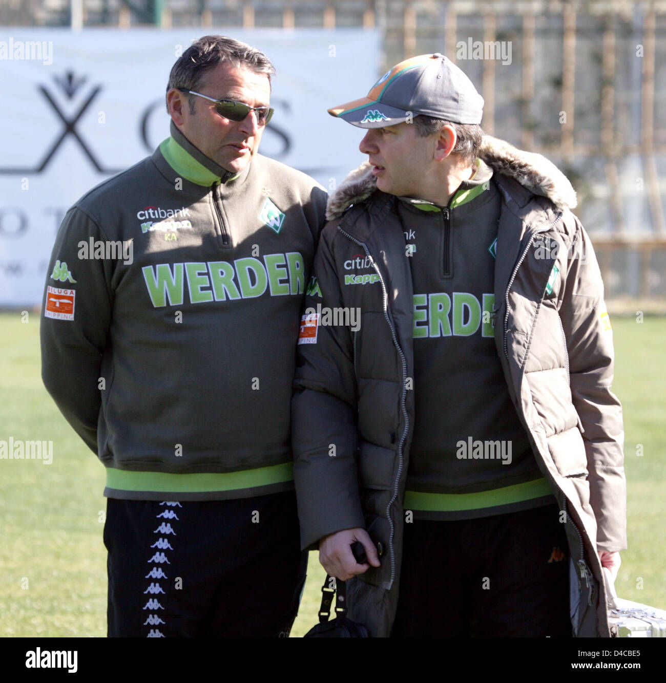 Managing director of Werder Bremen Klaus Allofs (L) talks to team doctor Goetz Dimanski during the team's training camp in Belek near Antalya, Turkey, 10 January 2008. Photo: Achim Scheidemann Stock Photo