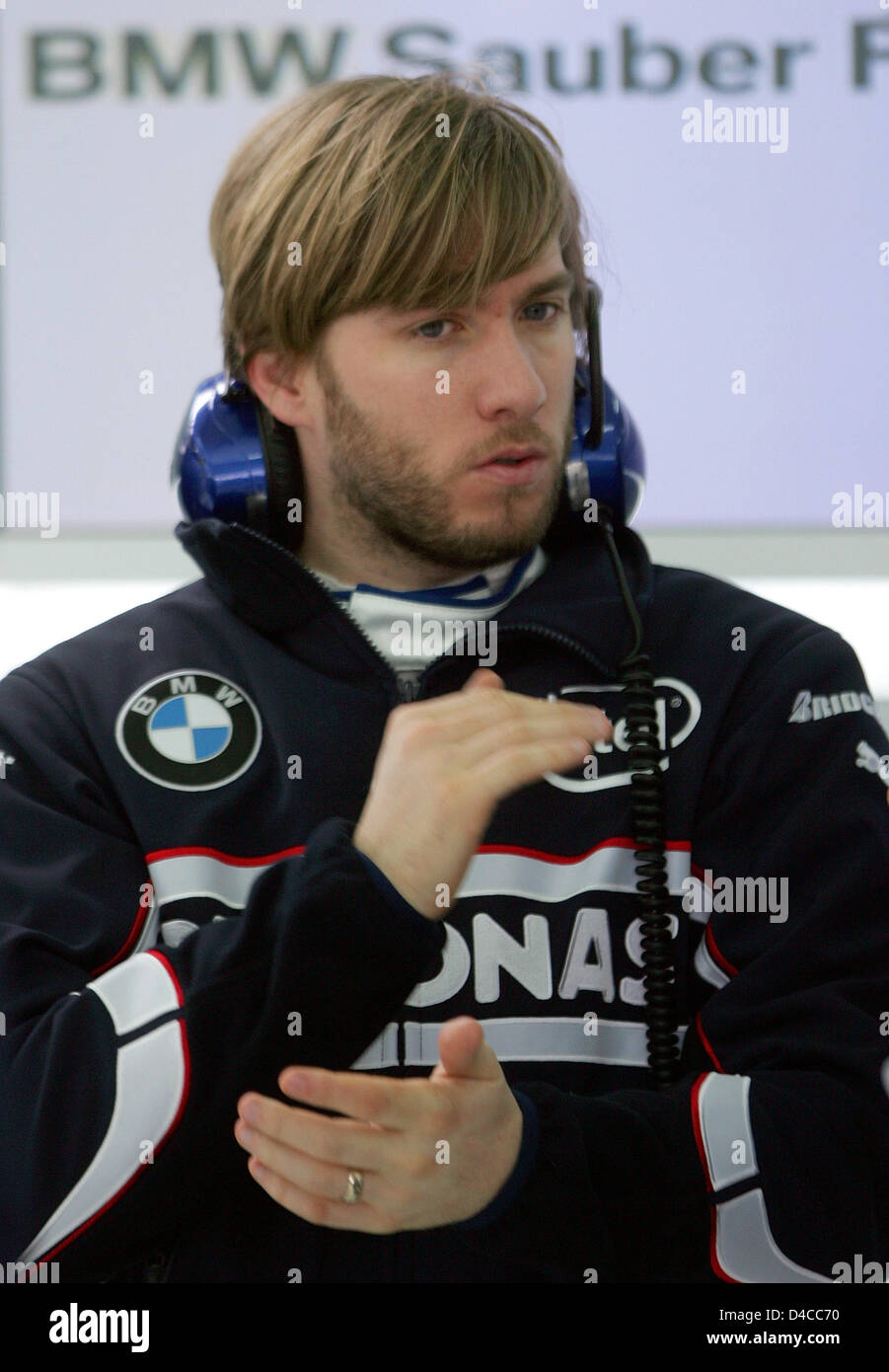 German Formula One driver Nick Heidfeld of BMW Sauber (R) gestures before the new 'F1.08' roll-out for a test drive on the circuit of Valencia, Spain, 15 January 2008. The new F1 car was presented the previous day in Munich, Germany. Photo: GERO BRELOER Stock Photo