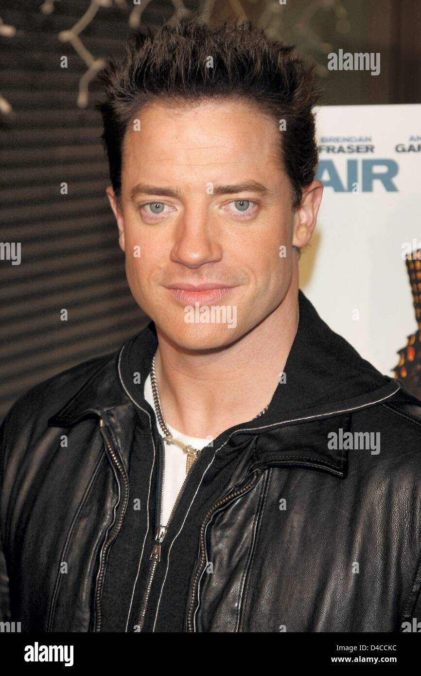 US actor Brendan Fraser poses for the camera as he arrives for the premiere of 'The Air I