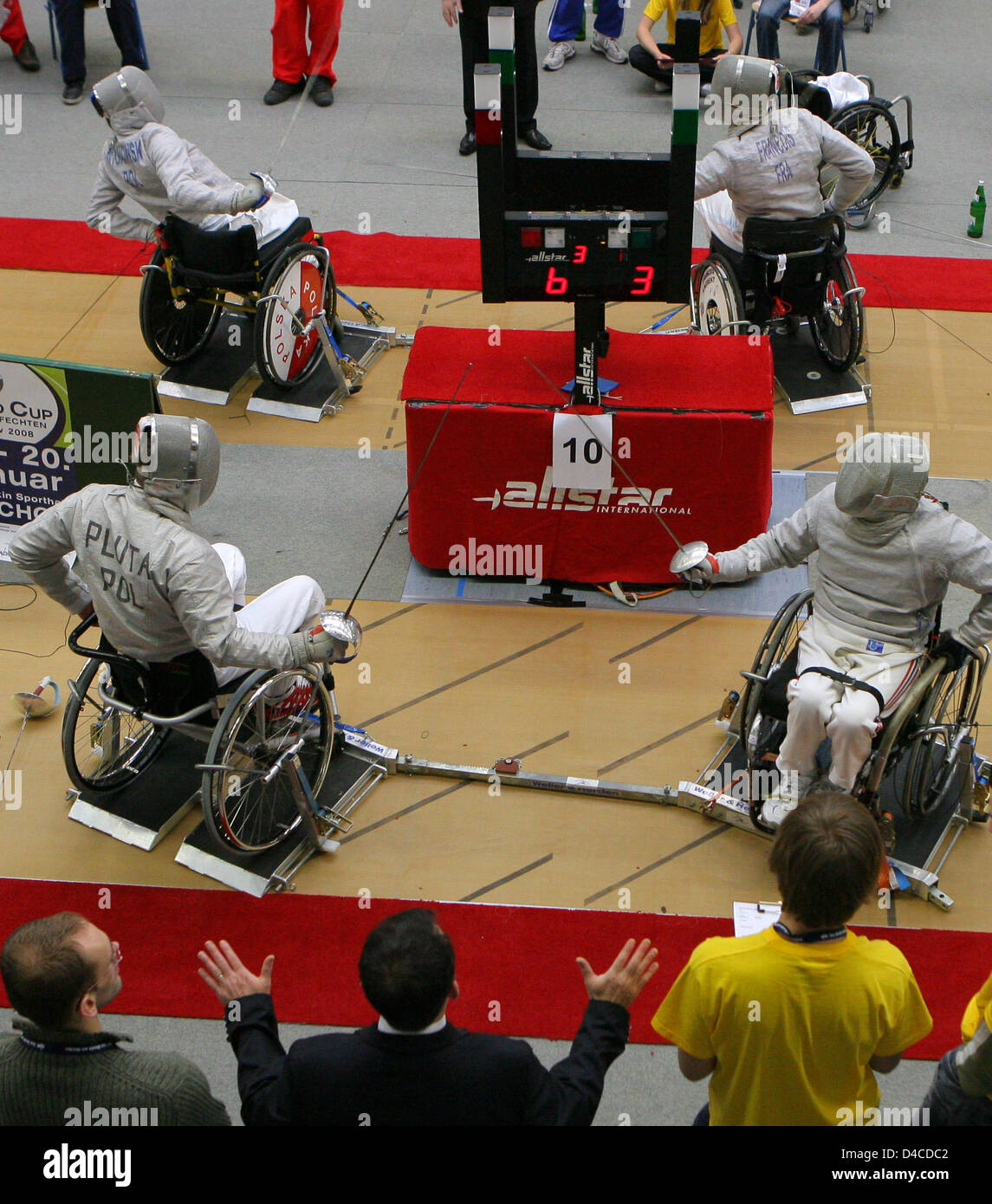 Wheel chair fencers shown in action during a preliminary round fight at the Wheel Chair World Cup in Malchow, Germany, 18 January 2008. Until Sunday 20 January 2008 113 athletes from 21 countries compete at  the World Cup event, which resembles a final chance to qualify for the Paralympics in Beijing. Photo: BERND WUESTNECK Stock Photo