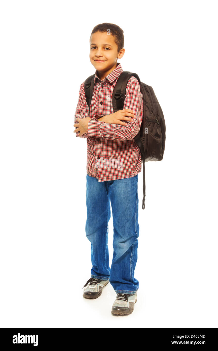 Cute 8 years old black boy with backpack - full height portrait isolated on white Stock Photo