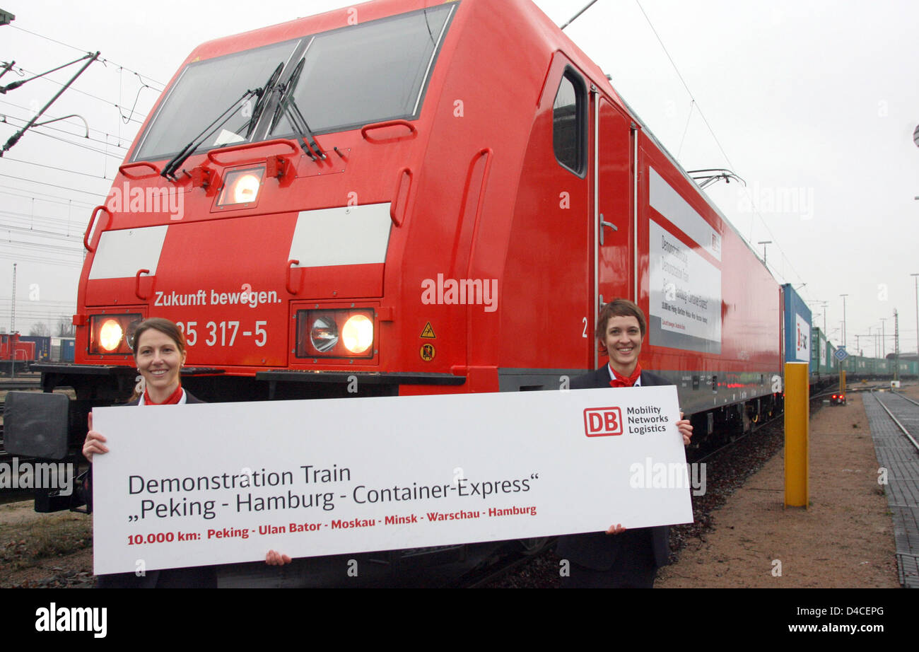 German Container Train Two hostesses of German railway Deutsche Bahn proudly smile standing in ...