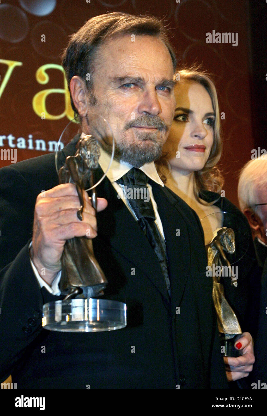 Italian actor Franco Nero shows his Diva award at the Diva entertainment  award gala in Munich, 24 January 2008. Nero was admitted to the Diva 'Hall  of Fame'. Nina Hoss is pictured