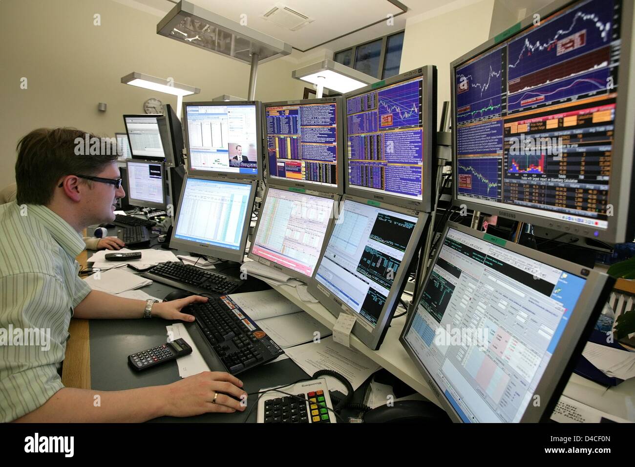 A Broker Monitors His Screeens With The Stock Quotations In Despair Stock Photo Alamy A Broker Monitors His Screeens With The Stock Quotations In Despair Stock Photo Alamy