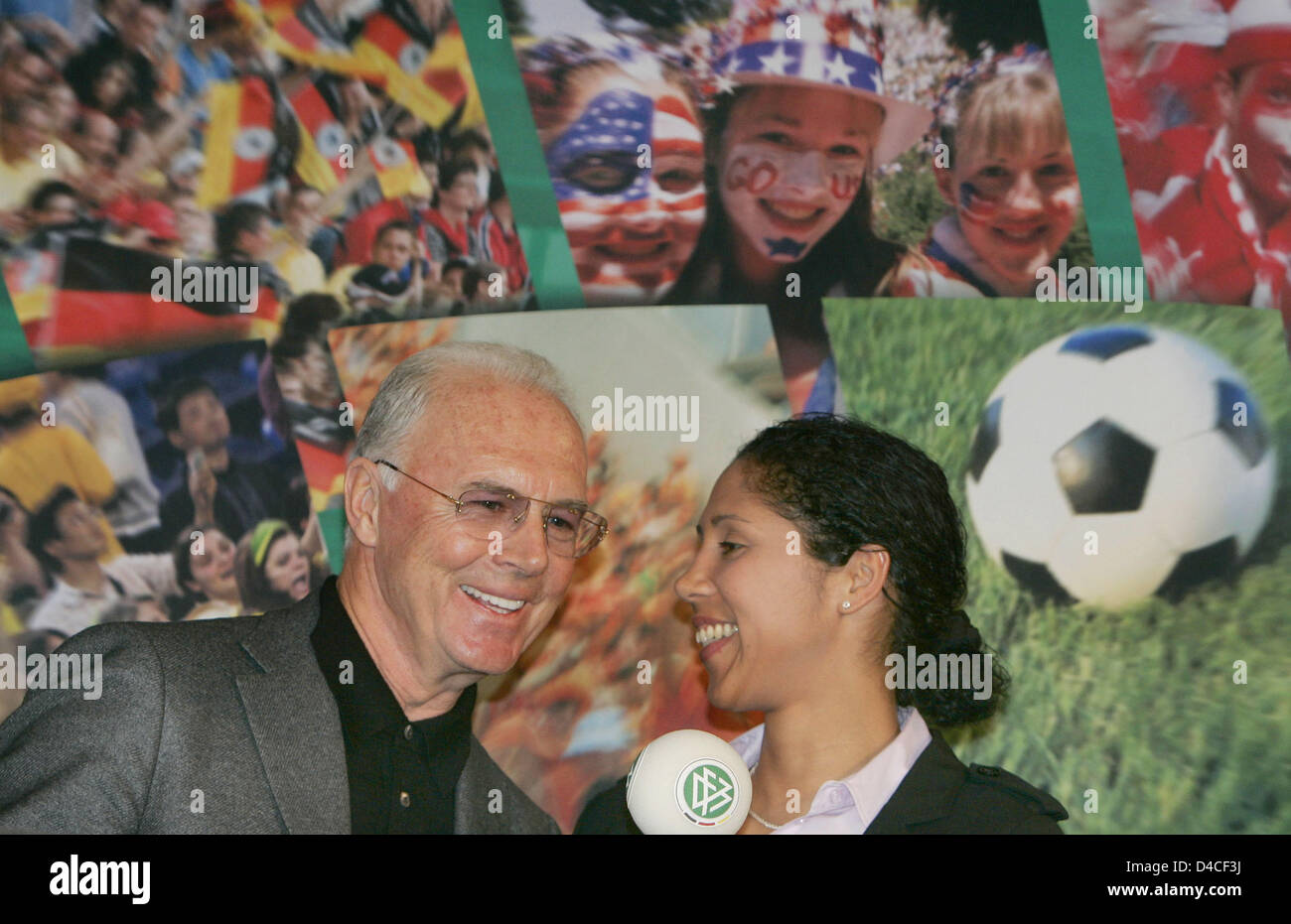 German soccer legend Franz Beckenbauer (L) symbolically shares an intimate moment with Steffi Jones (R), President of the 2011 FIFA Women's World Cup organisation committee (OC) and former international midfielder for Germany, during a press conference of the German Soccer Federation (DFB) In Frankfurt Main, Germany, 25 January 2008. The OC officially picked up its work with the in Stock Photo