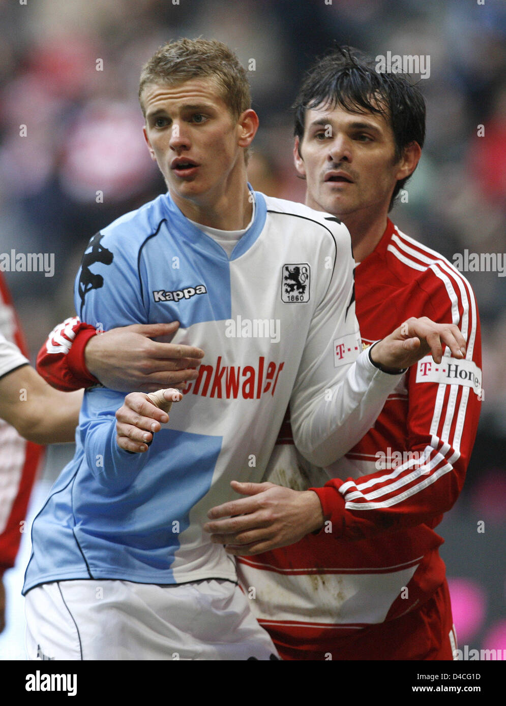 Bayern Munich's Willy Sagnol (R) and 1860 Munich's Lars Bender (L) shown in  action during the soccer friendly FC Bayern Munich vs TSV 1860 Munich at  Allianz-Arena in Munich, Germany, 26 January