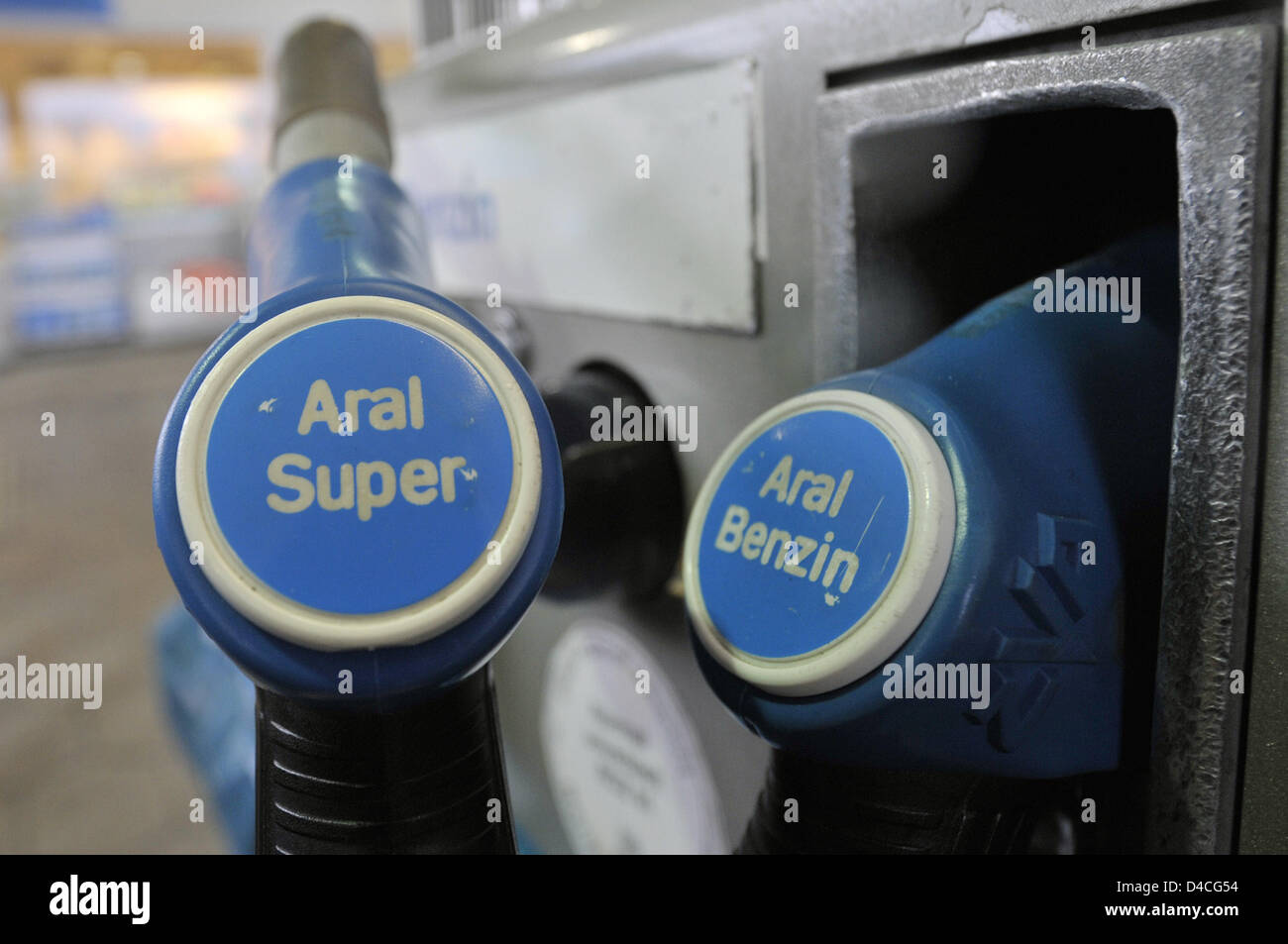 Fuel nozzles for premium and regular gasoline are pictured at a Aral gas station in Duesseldorf