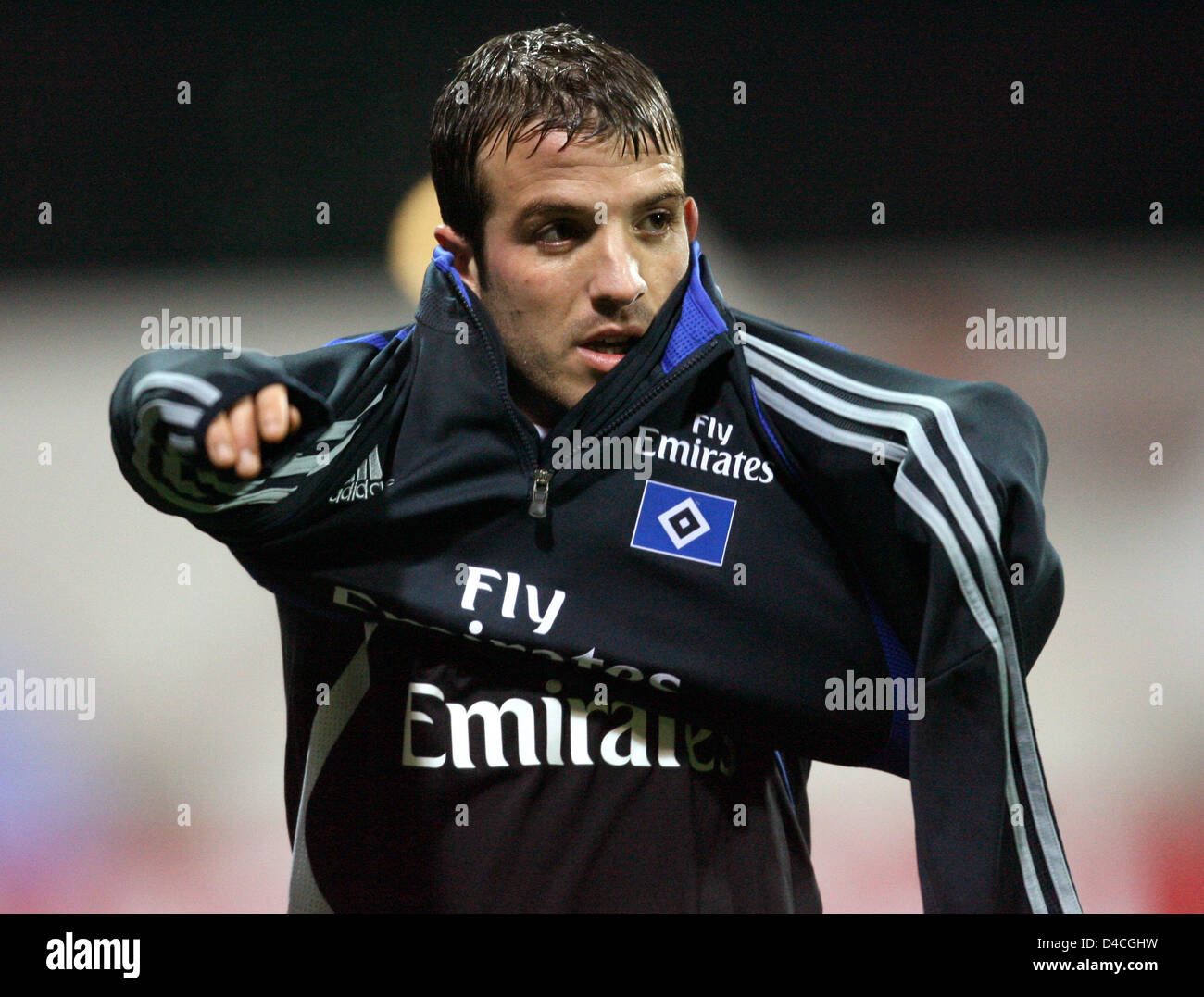 Rafael van der Vaart of Hamburg puts on his jumper when being substituted from the DFB Cup round