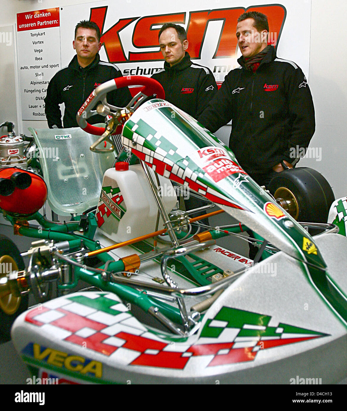 Peter Kaiser, Thomas Muchow and Michael Schuhmacher (L-R) pose behind a cart in Bergheim, Germany, 02 February 2008. The three men are the owners of restructured company 'KSM Motorsport'. The public was invited to visit the company premises today, on the official opening day 02 February. Photo: FREDRIK VON ERICHSEN Stock Photo