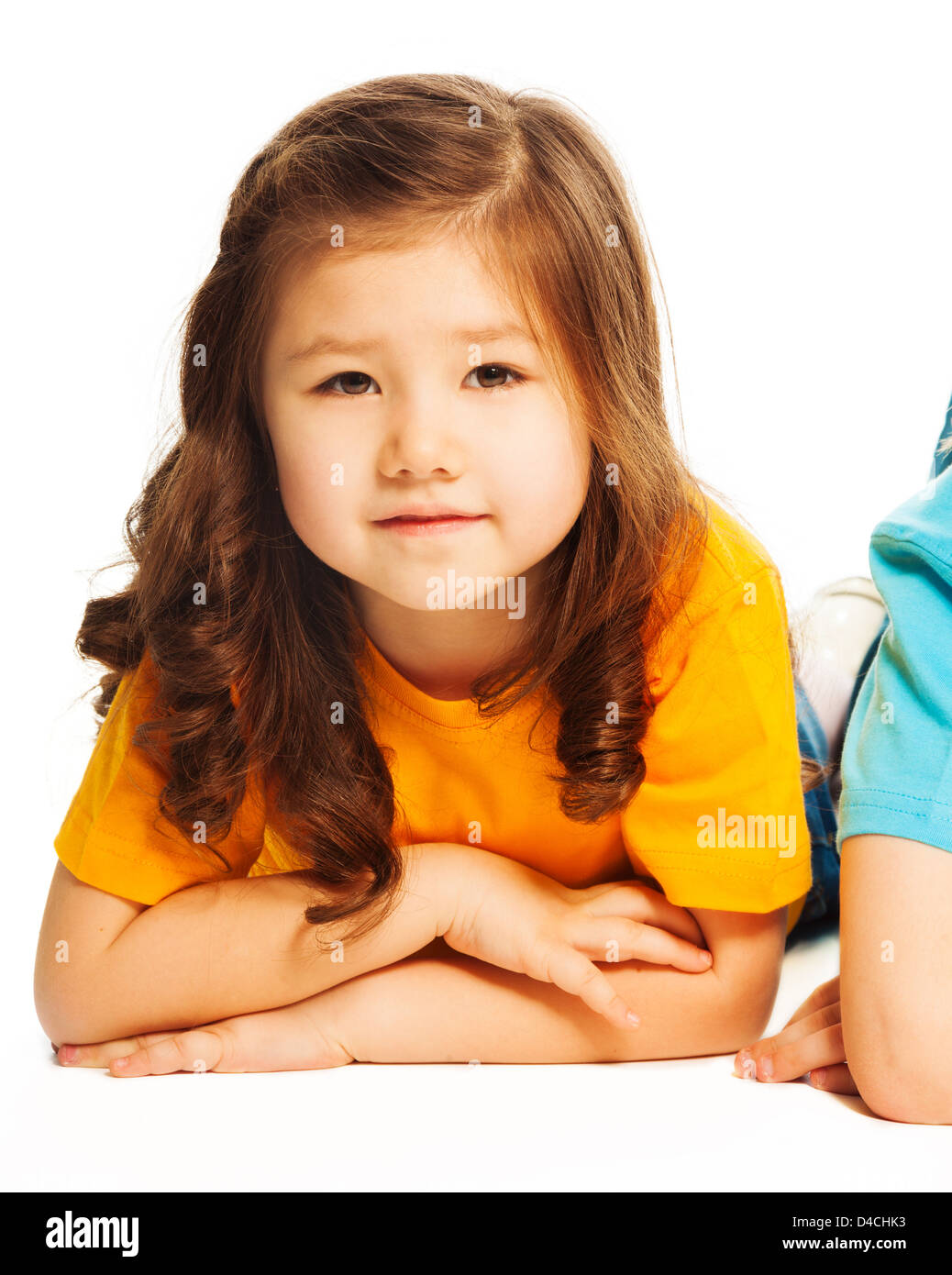 Happy beautiful Asian girl with long dark hair isolated on white Stock Photo