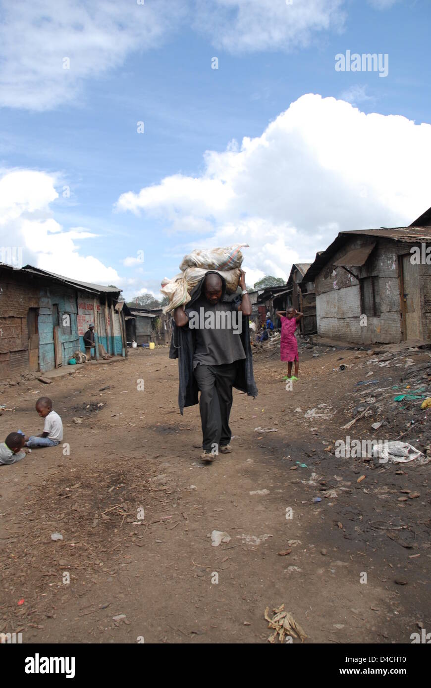The picture shows a daily life scene in the streets of the Mathare ...