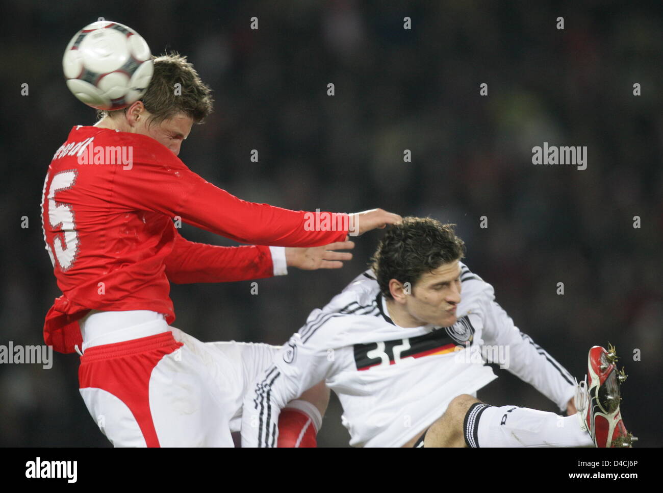 Germany's Mario Gomez (R) vies for the ball with Austria's Sebastian Proedl during the international friendly match Austria vs Germany at Ernst-Happel-stadium in Vienna, Austria, 06 February 2008. Photo: Oliver Berg Stock Photo