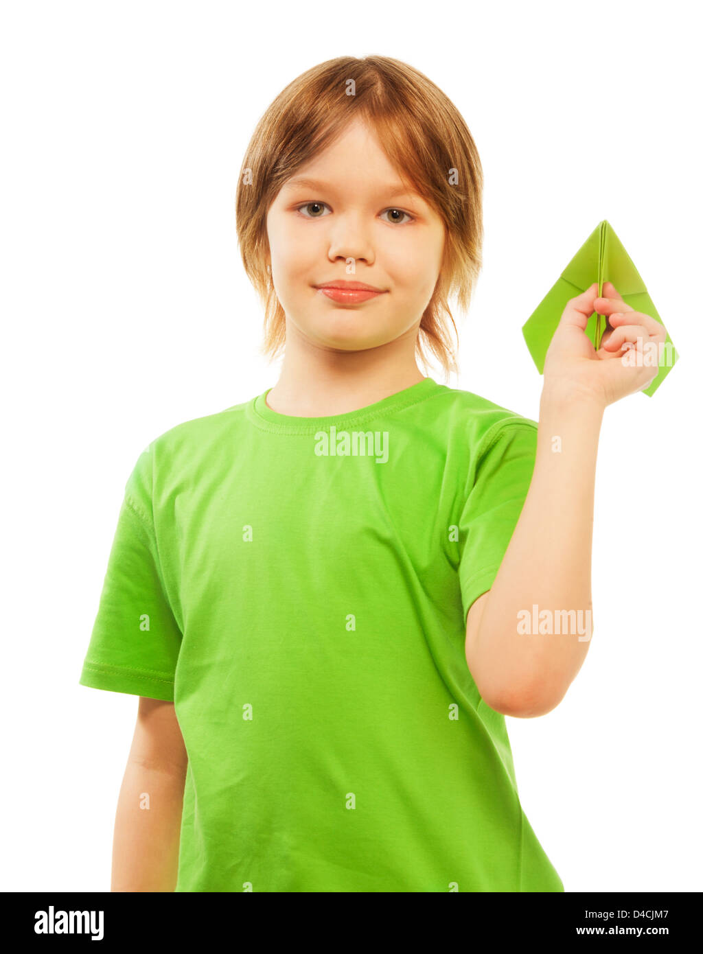 Happy Caucasian 9 years old boy in green shirt holding green paper