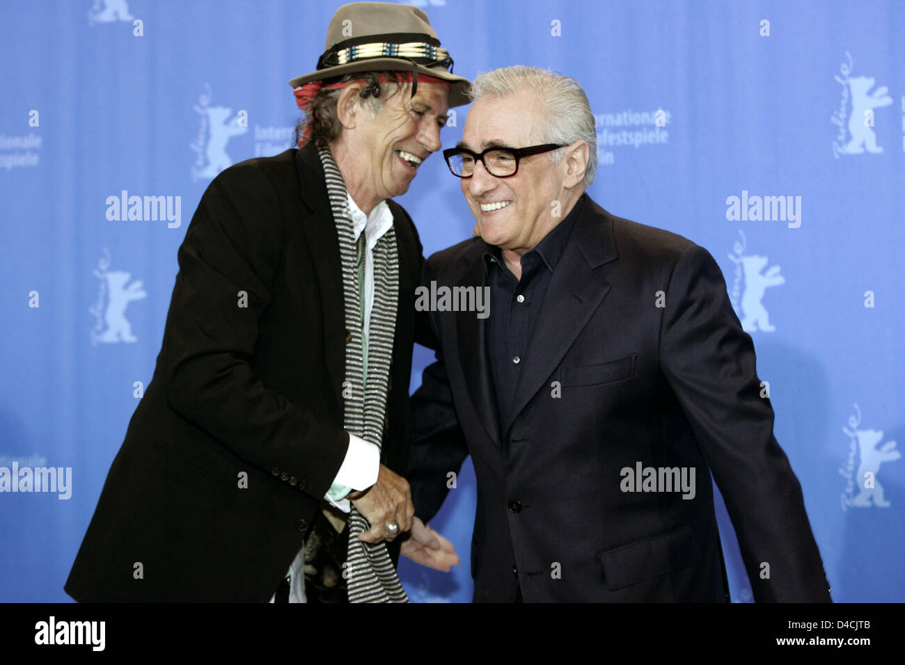 US director Martin Scorsese (R) and Keith Richards of the Rolling Stones  shake hands during the photo call for 'Shine A Light' at the 58th Berlin  International Film Festival in Berlin, Germany,