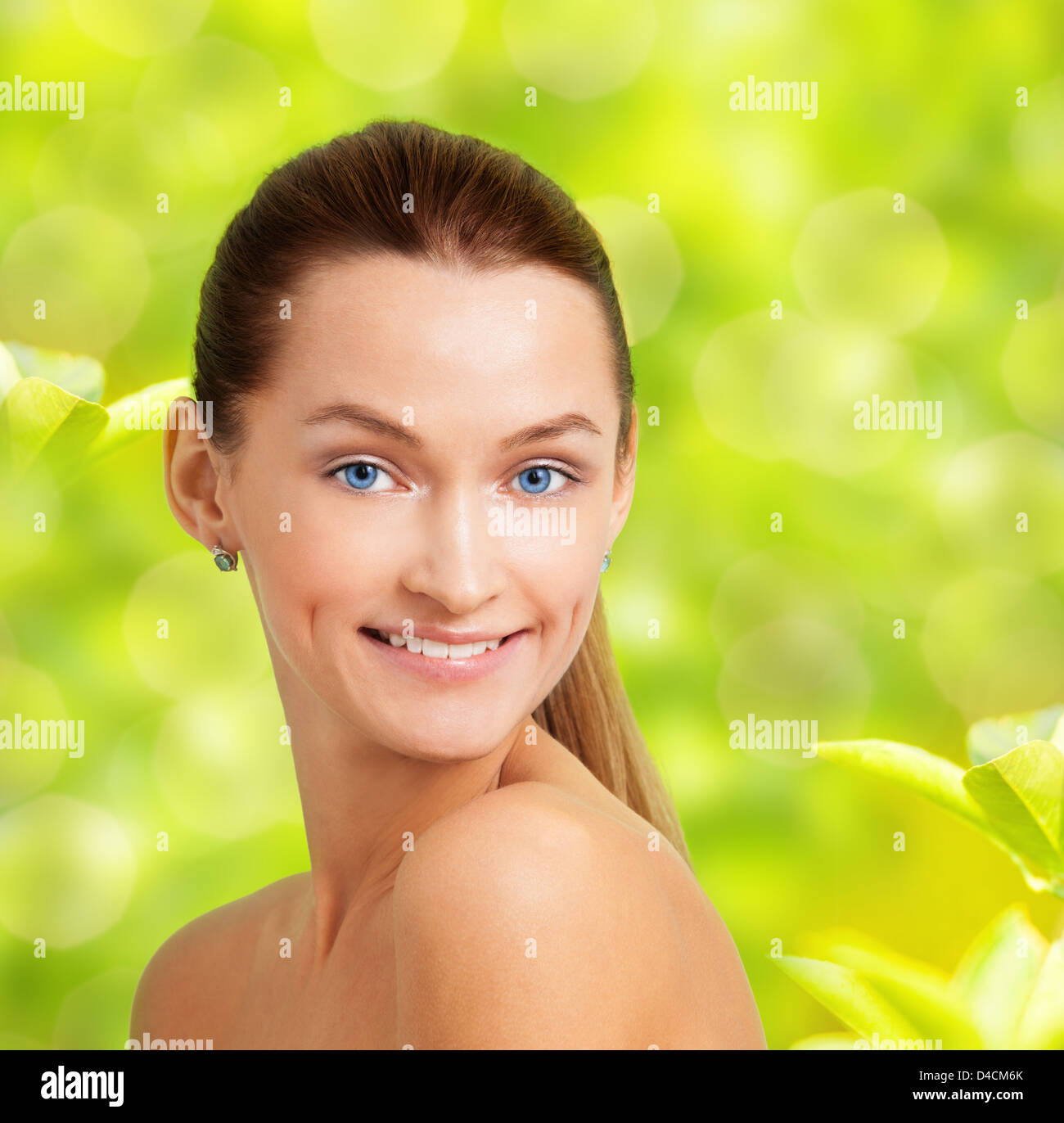 Happy smiling Caucasian young girl with long hair and blue eyes spring ...
