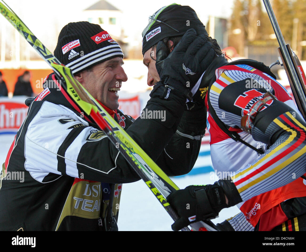 Alexander Wolf of Germany (R) is celebrated finishing third the 12.5km ...