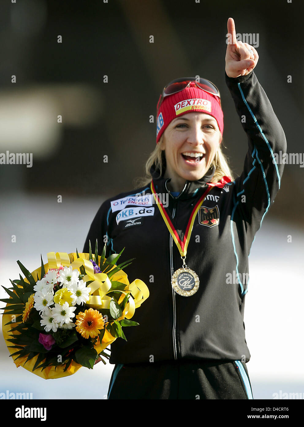 German Anni Friesinger celebrates her vistory in the 1000m competition at the Speed Skating Sprint World Cup in Inzell, southern Germany, 17 February 2008. 31 year-old Friesinger won her 54th World Cup race in 1:16,44 min. Photo: MATTHIAS SCHRADER Stock Photo