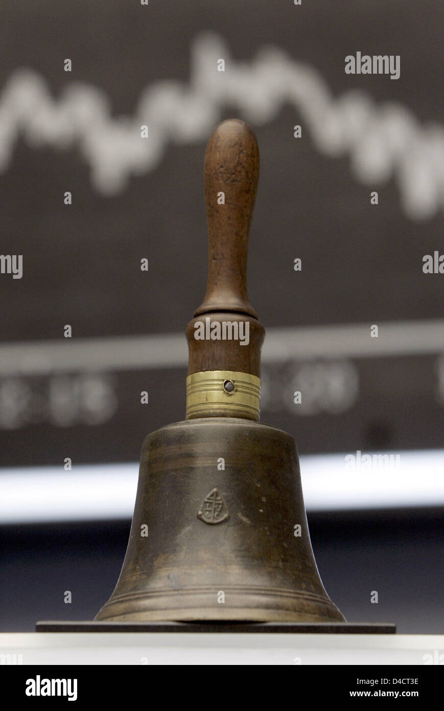 Stock Bell Ringing The traditional stock exchange bell is pictured in front of a display ...