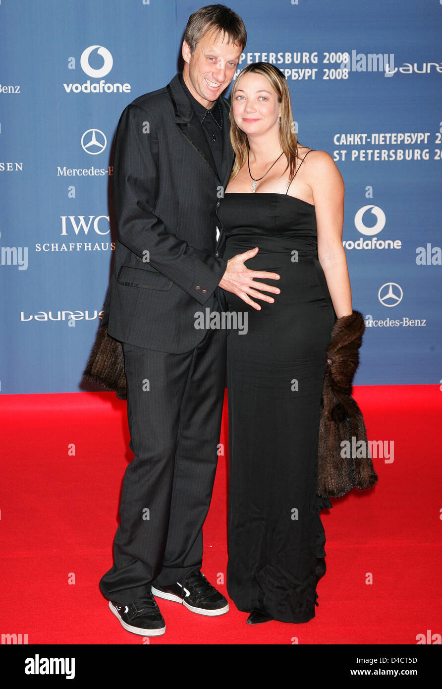 US skateboarding legend Tony Hawk (L) and his pregnant