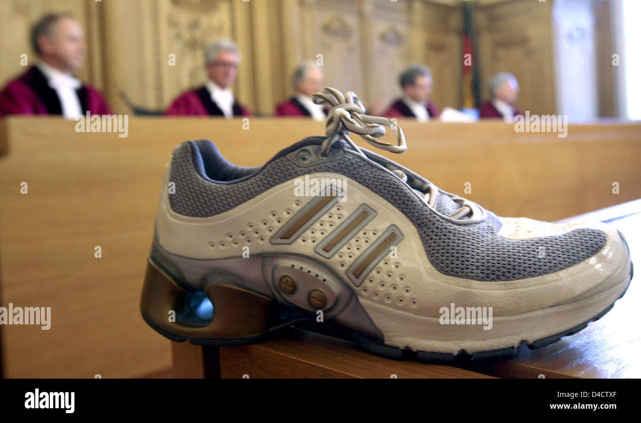 A running shoe with an electronic damping system of sports apparel  manufacturer 'adidas-Salomon AG' is pictured in the court room of the  Federal Administrative Court (BVG) in Leipzig, Germany, 21 February 2008.