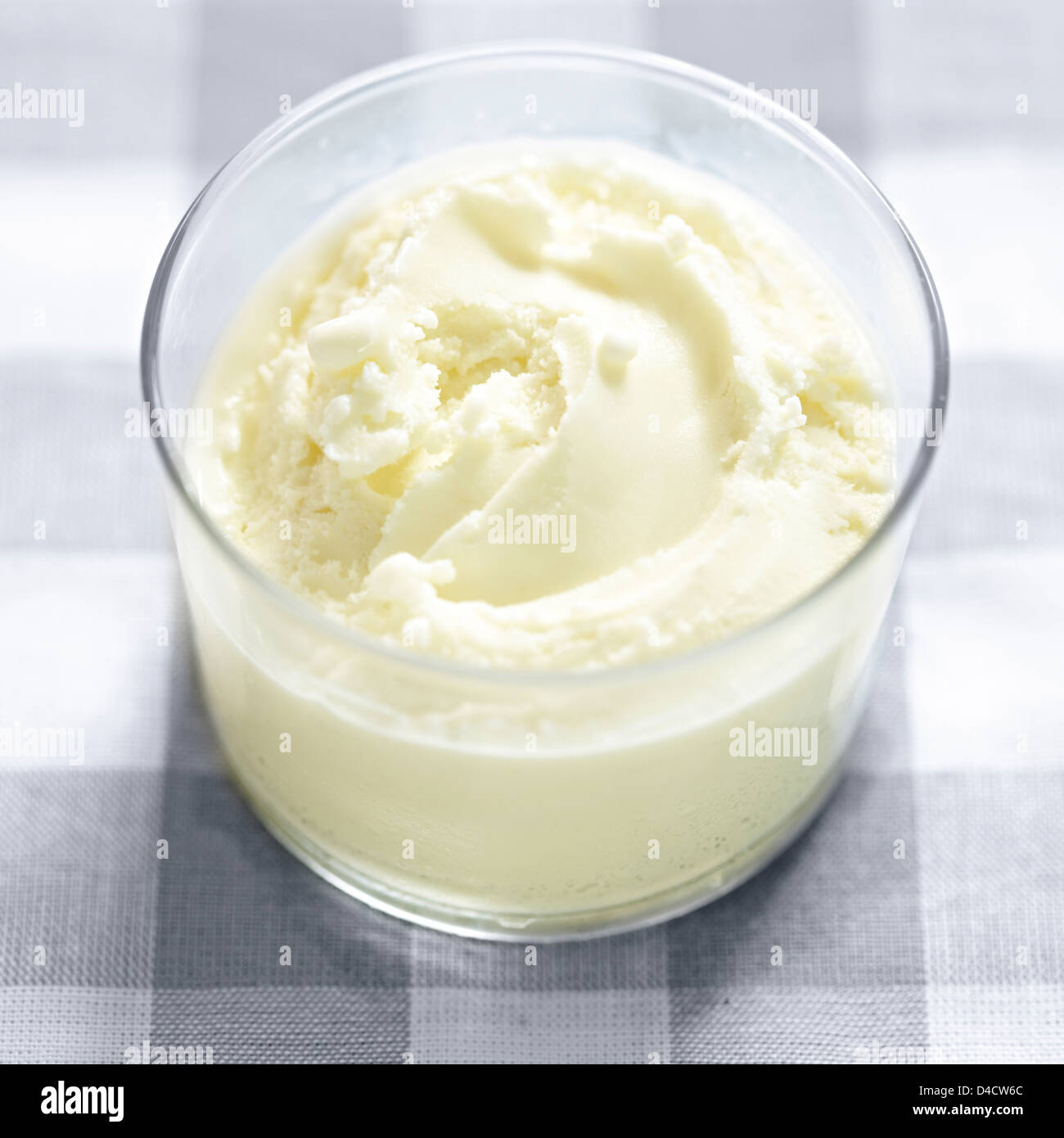 frozen yogurt glass dessert checked table cloth Stock Photo