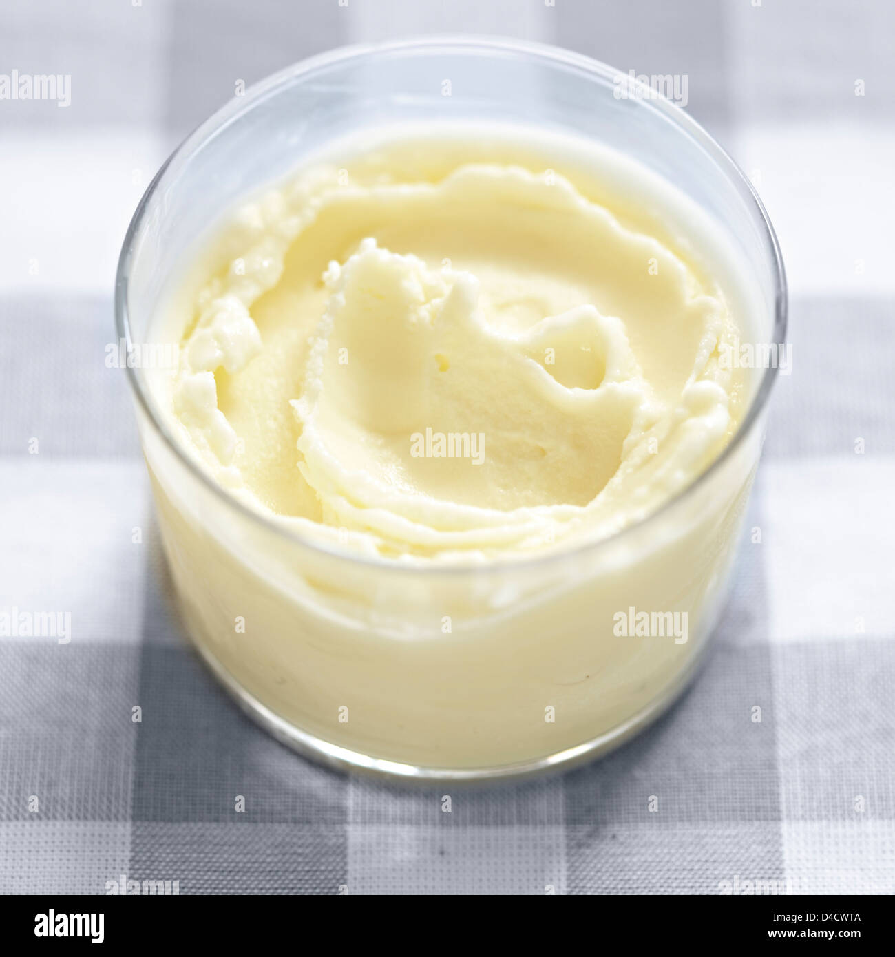 frozen yogurt glass dessert checked table cloth Stock Photo