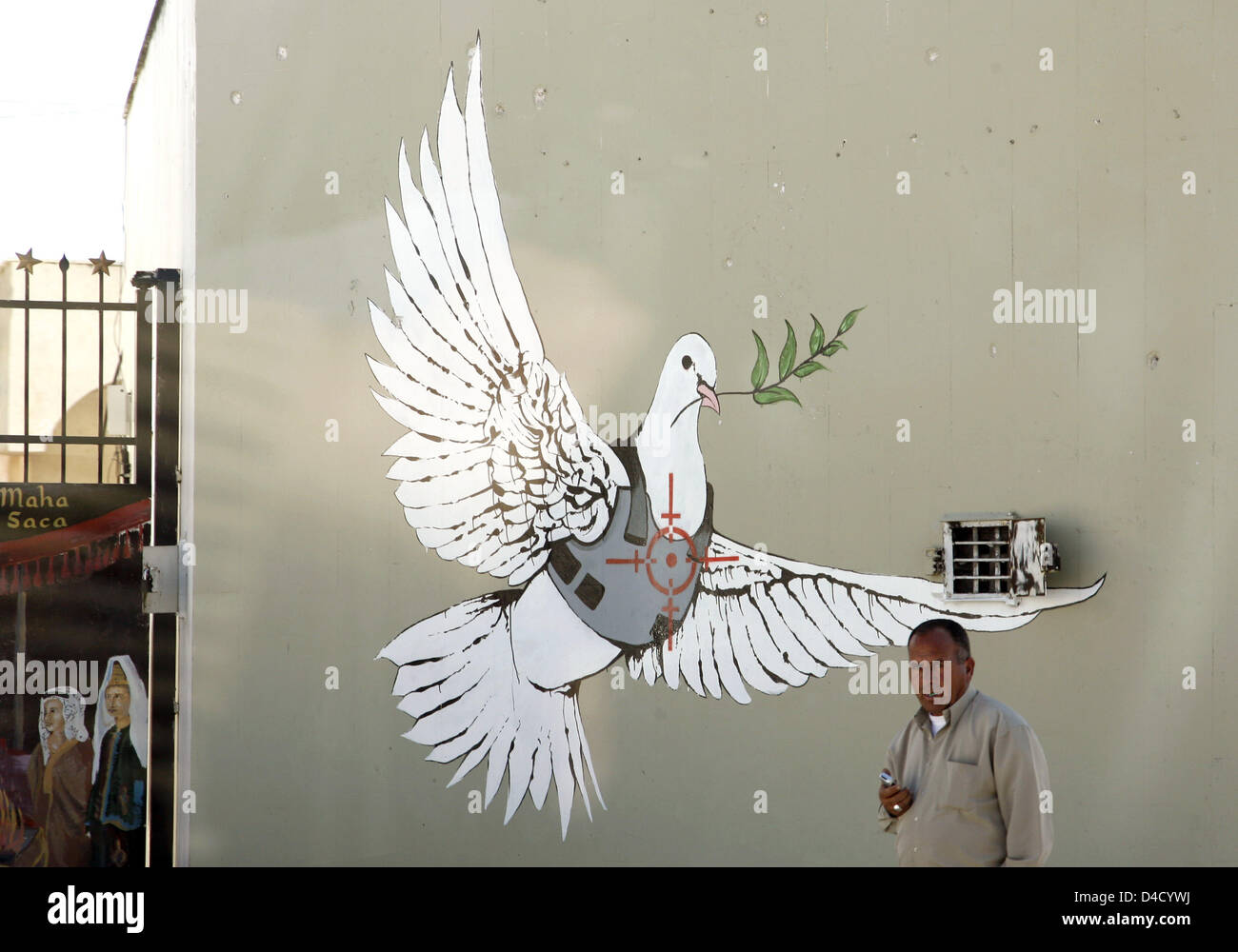 The painting on a wall in the Palestinian territories shows a dove
