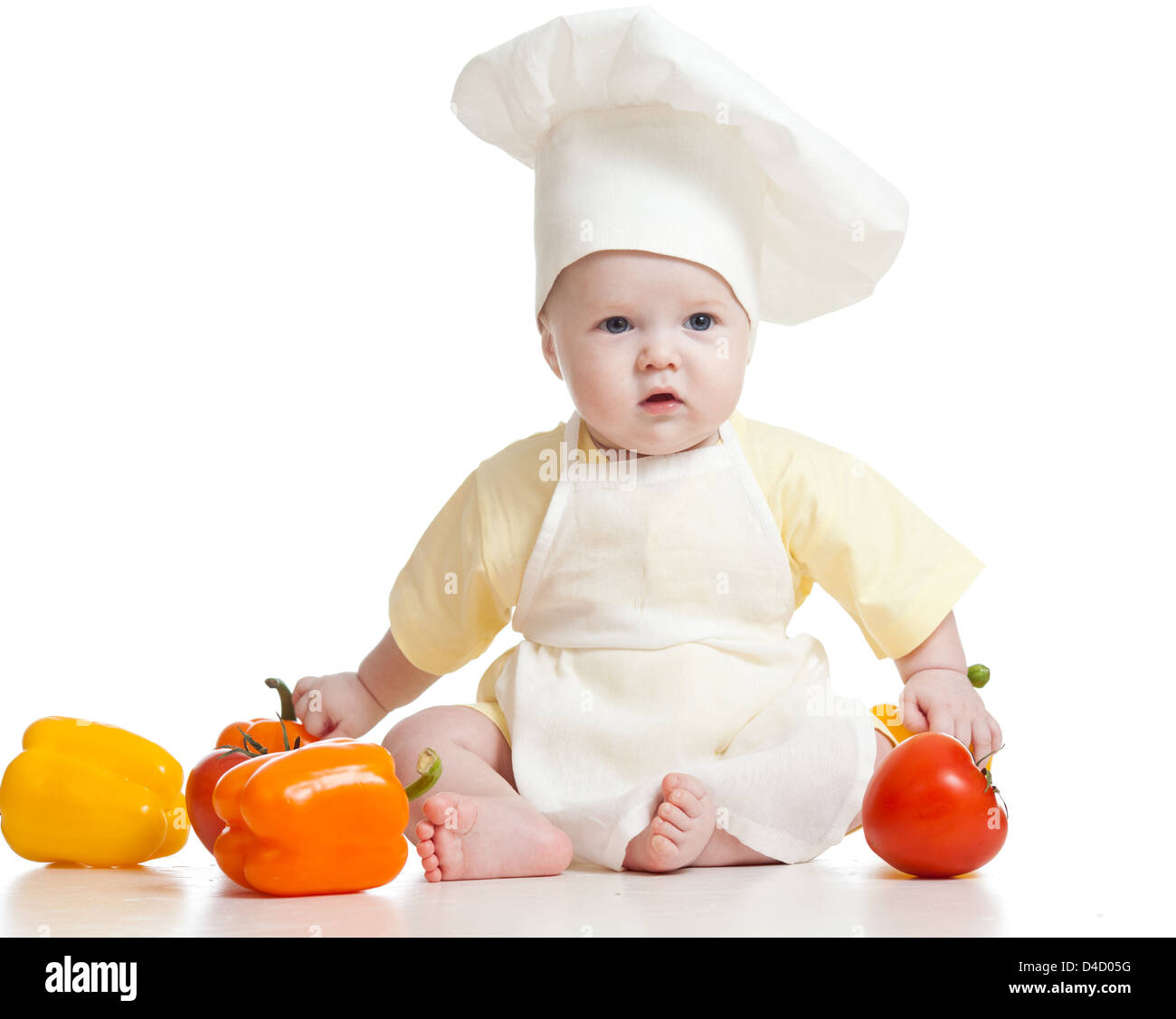 cute baby boy chef with healthy food vegetables, isolated on white ...