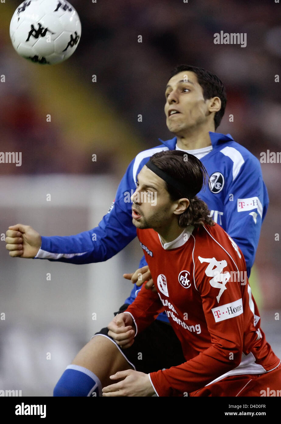 Benjamin Weigelt of Kaiserslautern (front) and Freiburg's Karim Matmour (back) vie for the ball in the Bundesliga 2nd division match 1.FC Kaiserslautern v SC Freiburg at Fritz Walter stadium of Kaiserslautern, Germany, 07 March 2008. Photo: RONALD WITTEK   (ATTENTION: EMBARGO CONDITIONS! The DFL permits the further utilisation of the pictures in IPTV, mobile services and other new  Stock Photo