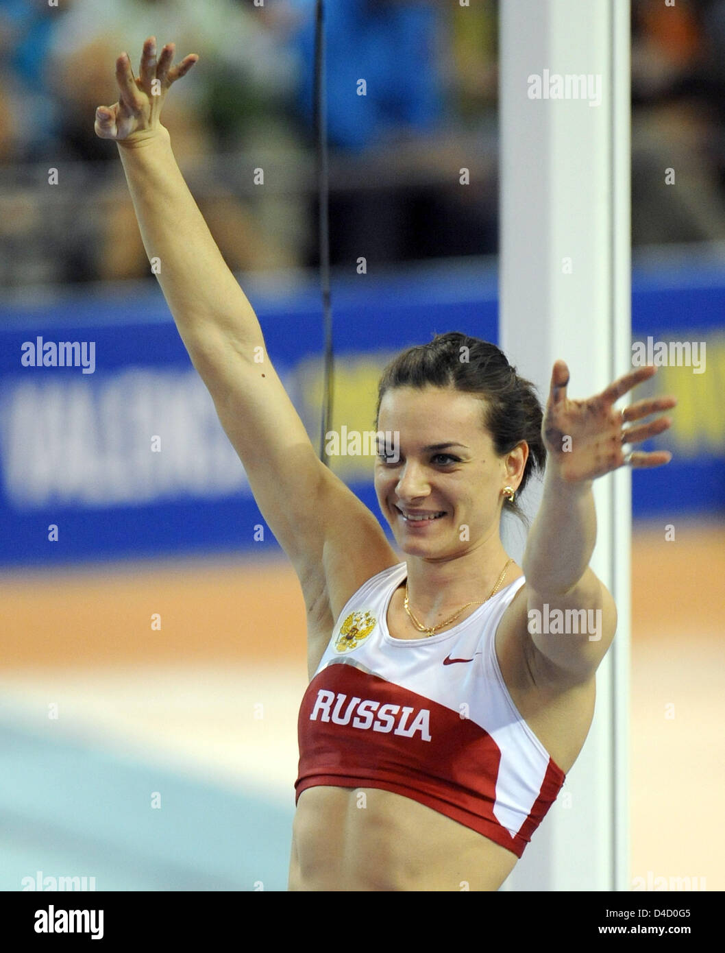 Russian pole vaulter Yelena Isinbayeva cheers qualifying at the 12th IAAF World Indoor