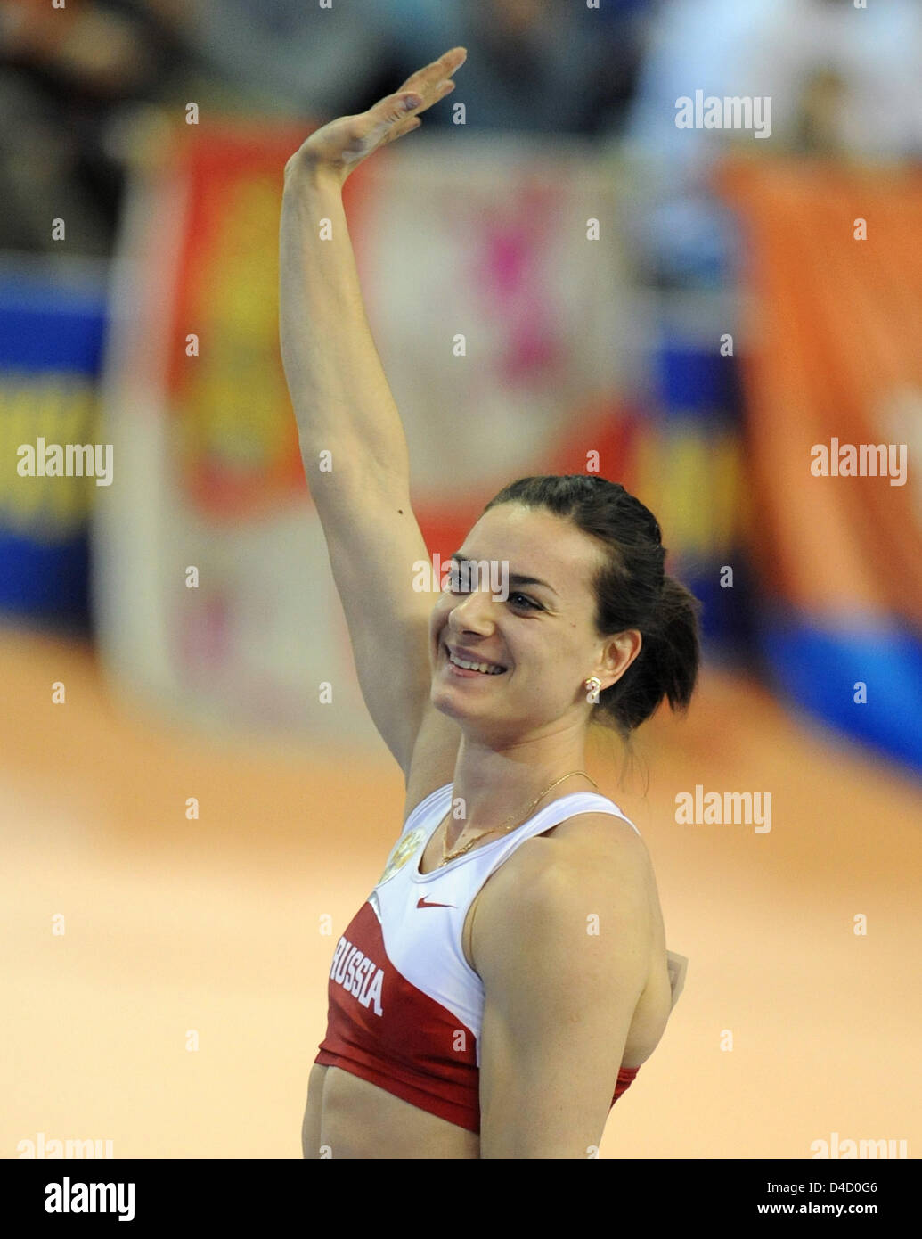 Russian pole vaulter Yelena Isinbayeva cheers qualifying at the 12th IAAF World Indoor