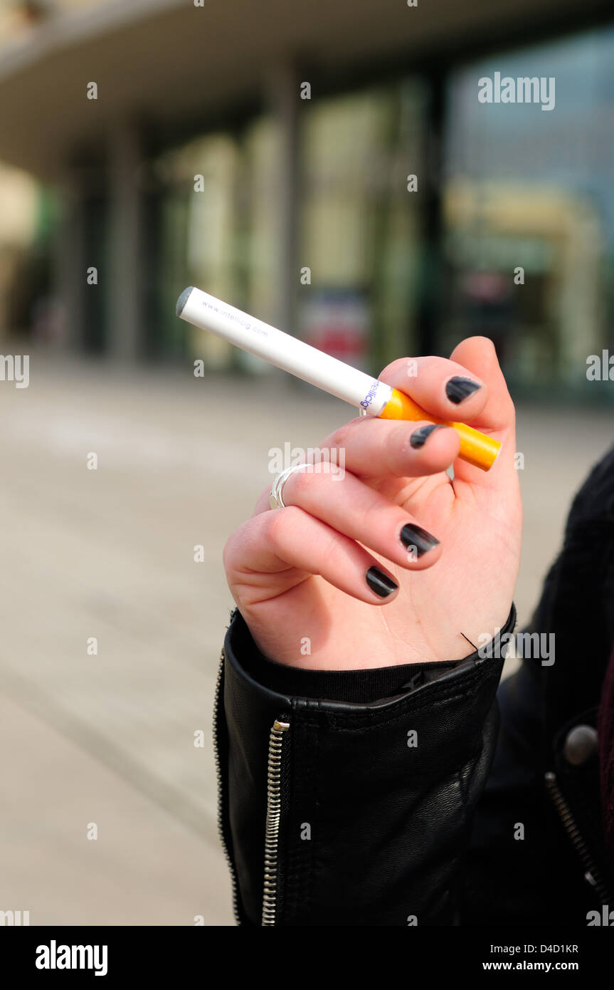 Nottingham, UK. 12th March 2013. Some buildings and shopping centers have banned the smoking of e-cigarettes in Nottingham city center.Student smoking e-cigarette.  Credit:  Ian Francis / Alamy Live News Stock Photo