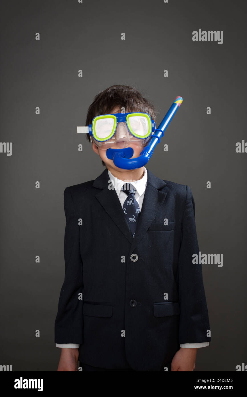 Boy wearing suit jacket and snorkel mask Stock Photo