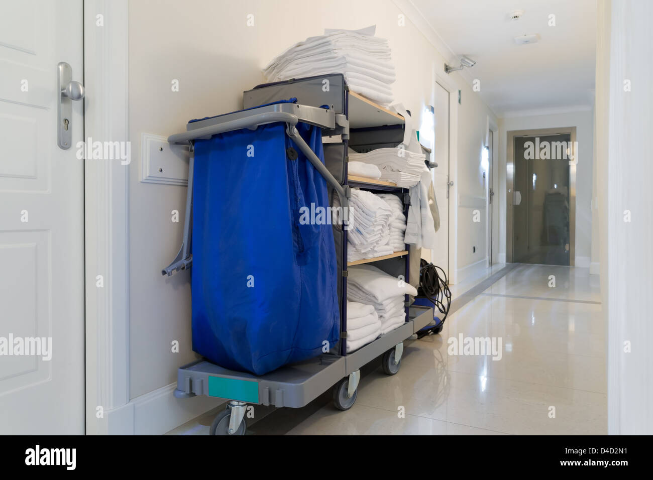 housekeeping cart in bright hotel corridor Stock Photo Alamy