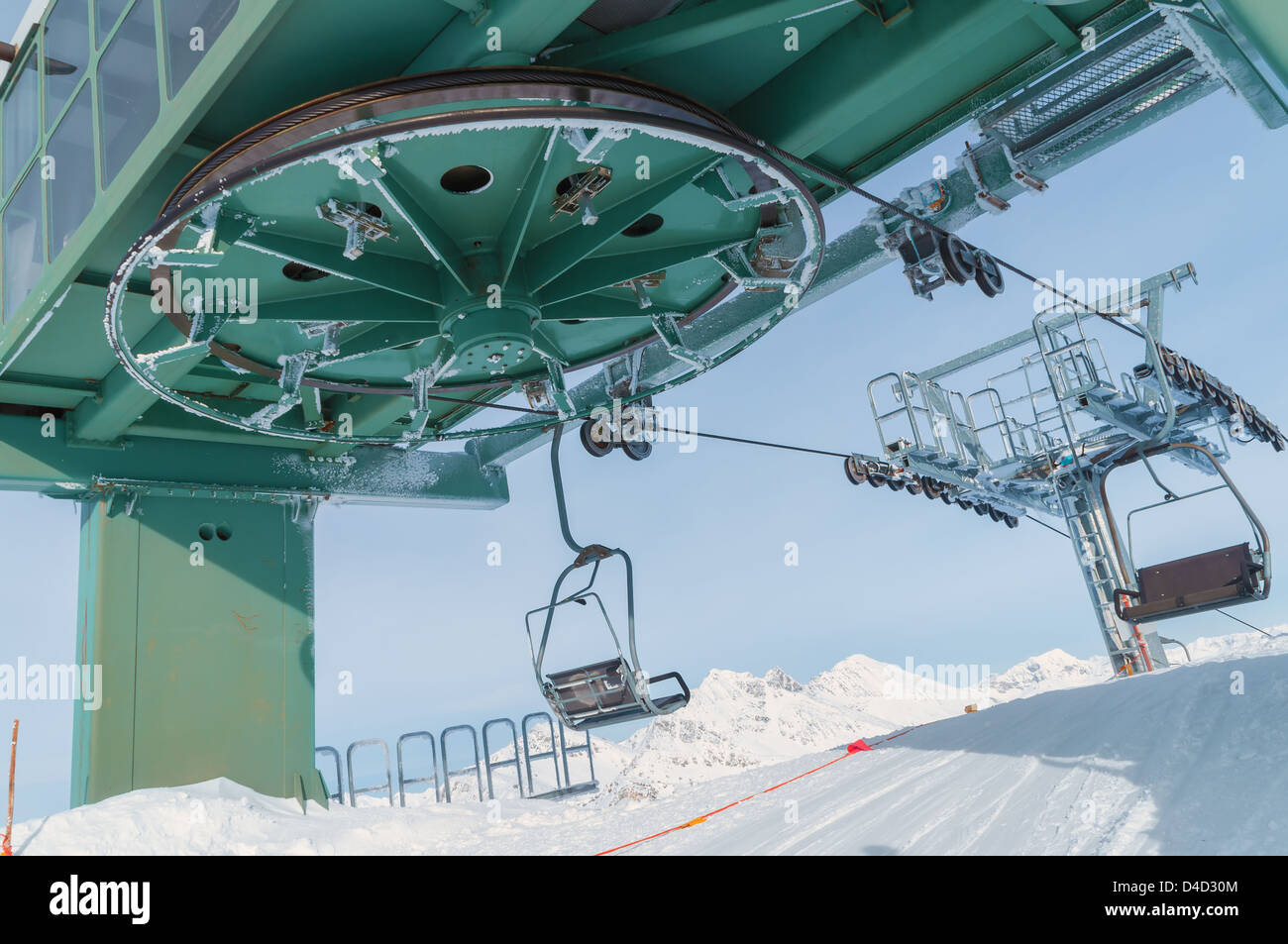 Big Chairlift Wheel In Italian Ski Area On Snow Covered Alps Stock