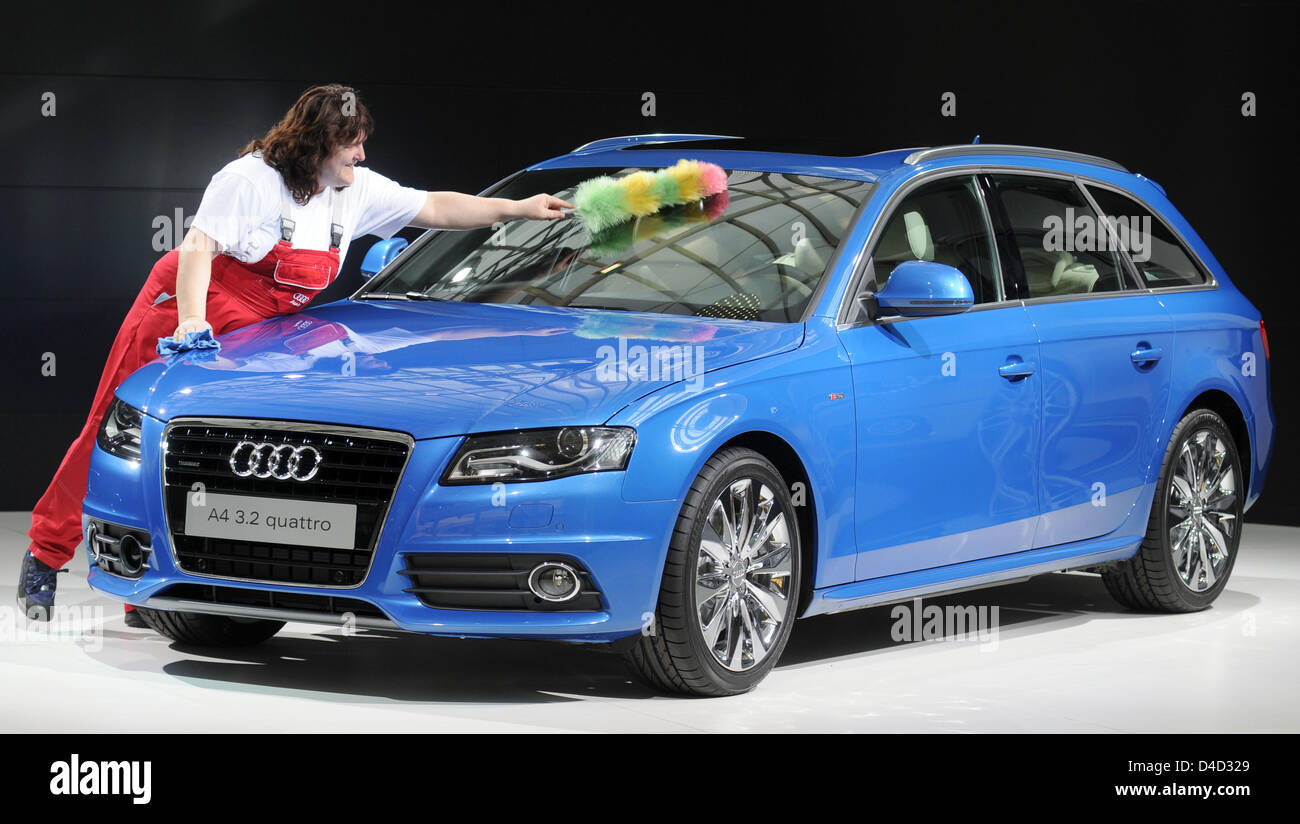 A cleaning woman dusts off a Audi A4 Avant before the annual press conference in Ingolstadt, Germany, 11 March 2008. Volkswagen subsidiary Audi has again achieved top results in turnover and profits in 2007 and aims to top those again in 2008. Pre-tax earnings rocketed by almost 50 per cent to 2.9 billion euro. Photo: ARMIN WEIGEL Stock Photo