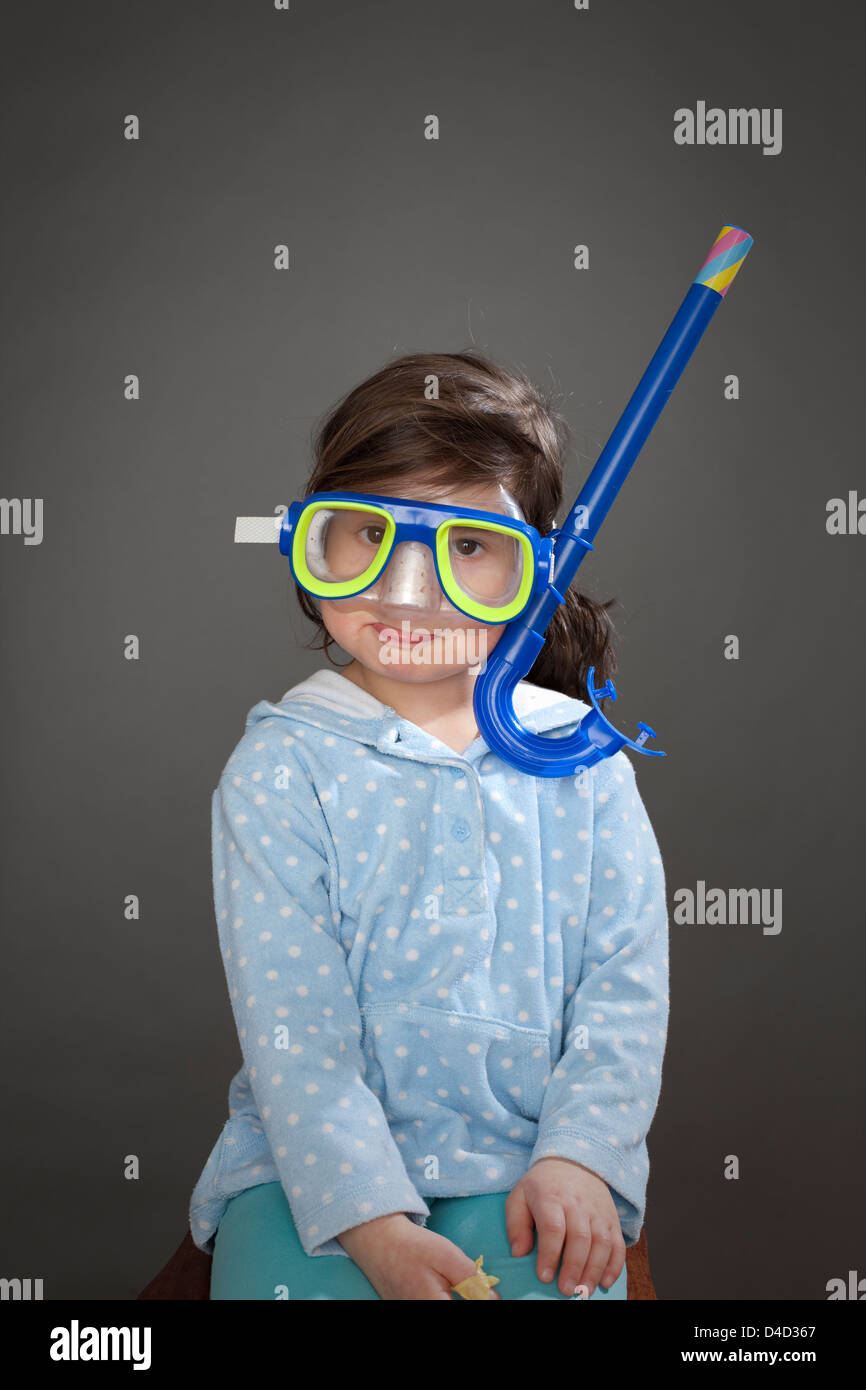 Girl wearing blue snorkel mask Stock Photo