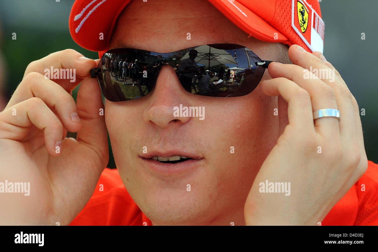 Finnish Formula One driver Kimi Raikkonen of Ferrari team walks on the