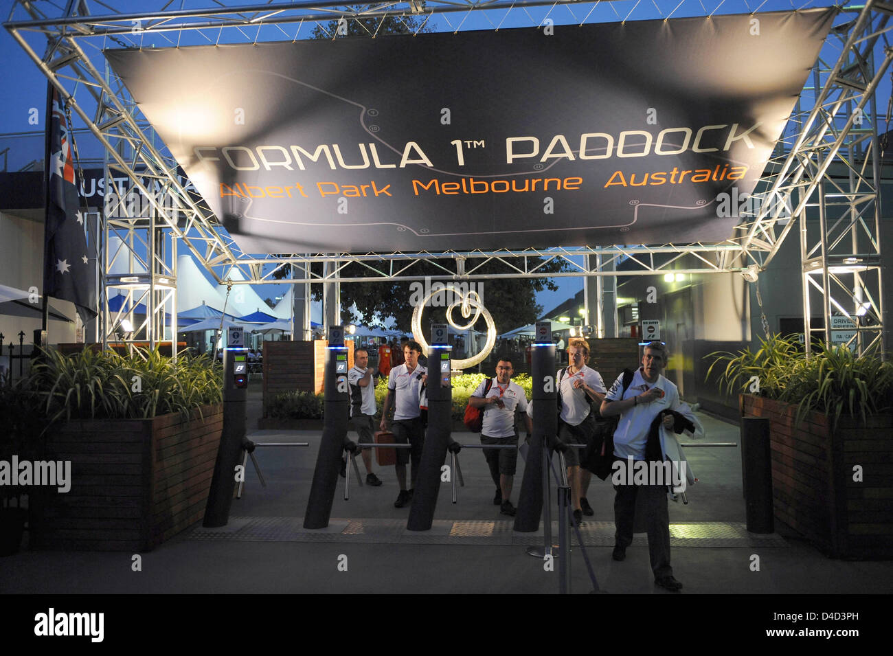 Mechanics Work In The Evening In The Illuminated Paddock Of Albert