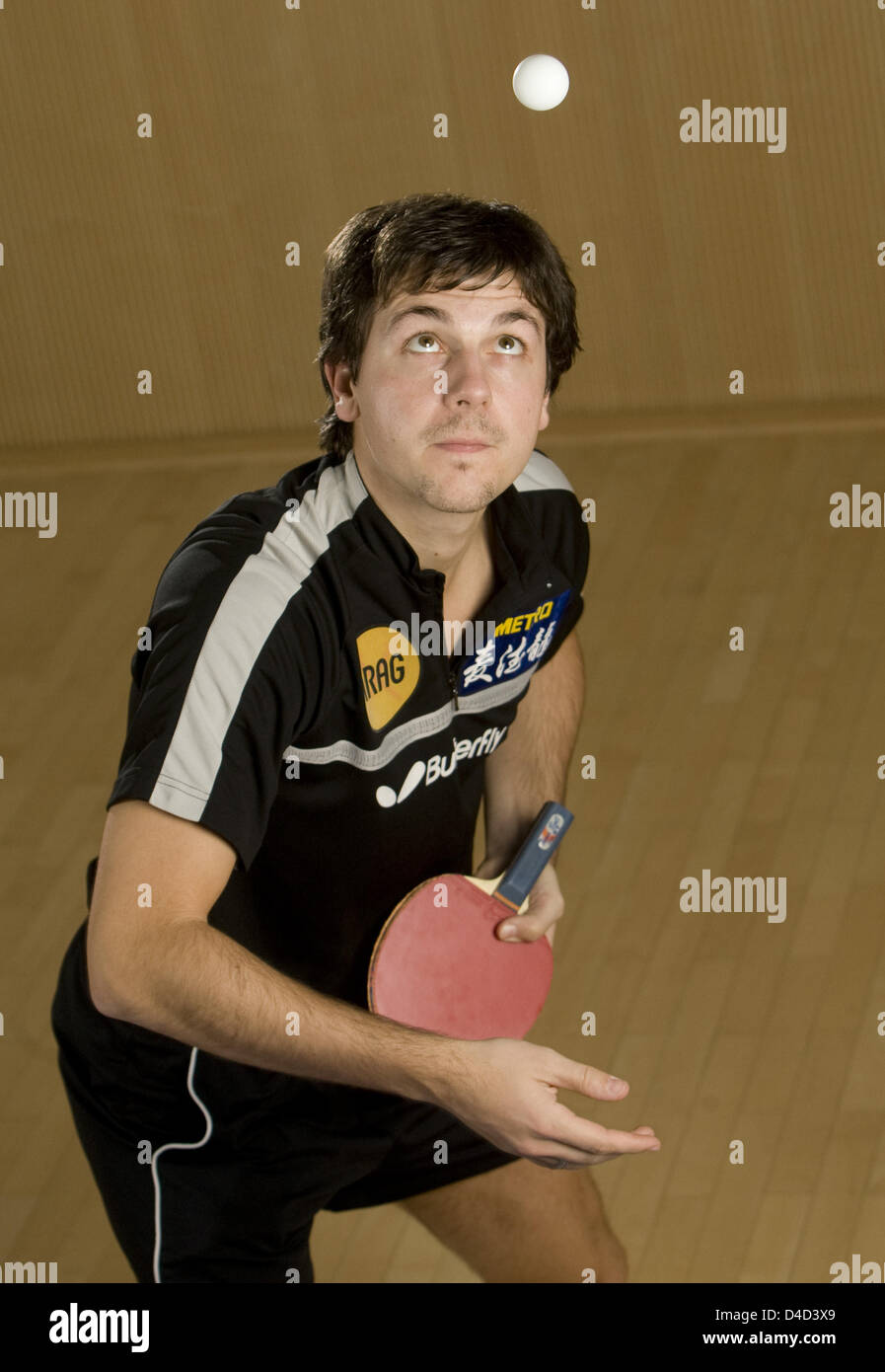 German table tennis pro Timo Boll performs a service during a photo