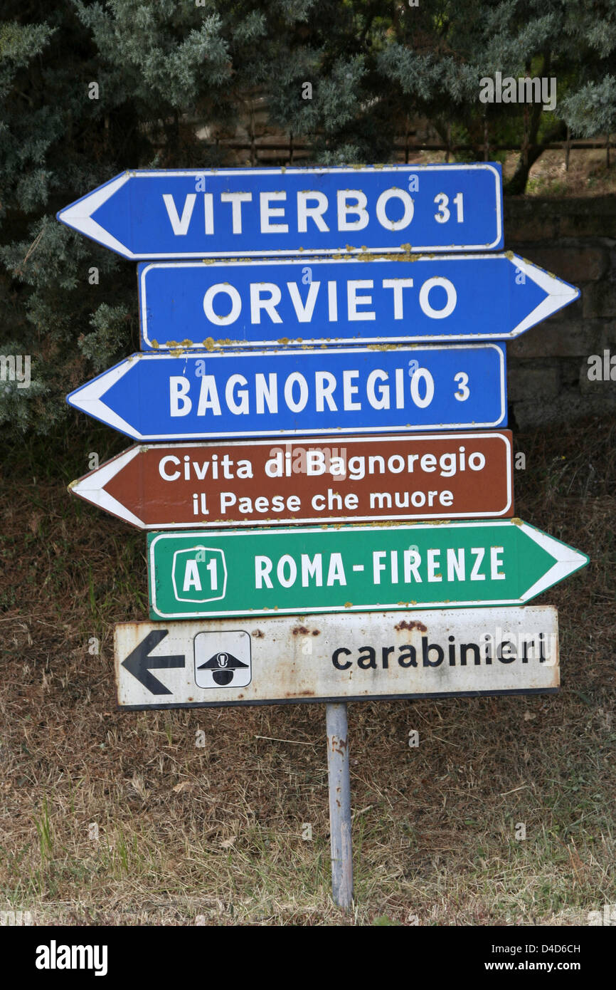 (dpa file) The file picture dated 06 August 2006 shows direction signs to various locations in the 'Paese che muore' ('Dying-out land') in the province Lazio of Italy. Photo: Lars Halbauer Stock Photo