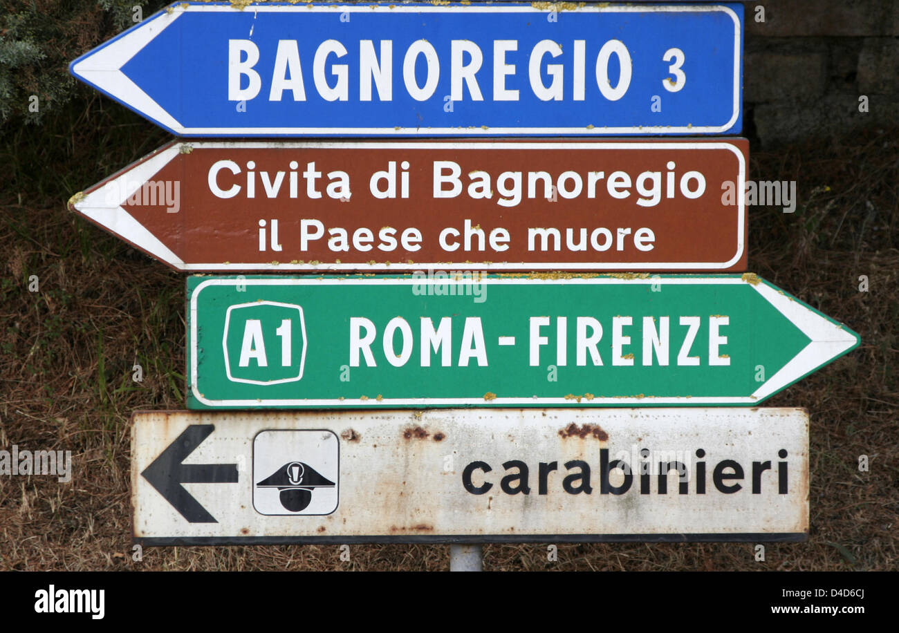 (dpa file) The file picture dated 06 August 2006 shows direction signs to various locations in the 'Paese che muore' ('Dying-out land') in the province Lazio of Italy. Photo: Lars Halbauer Stock Photo