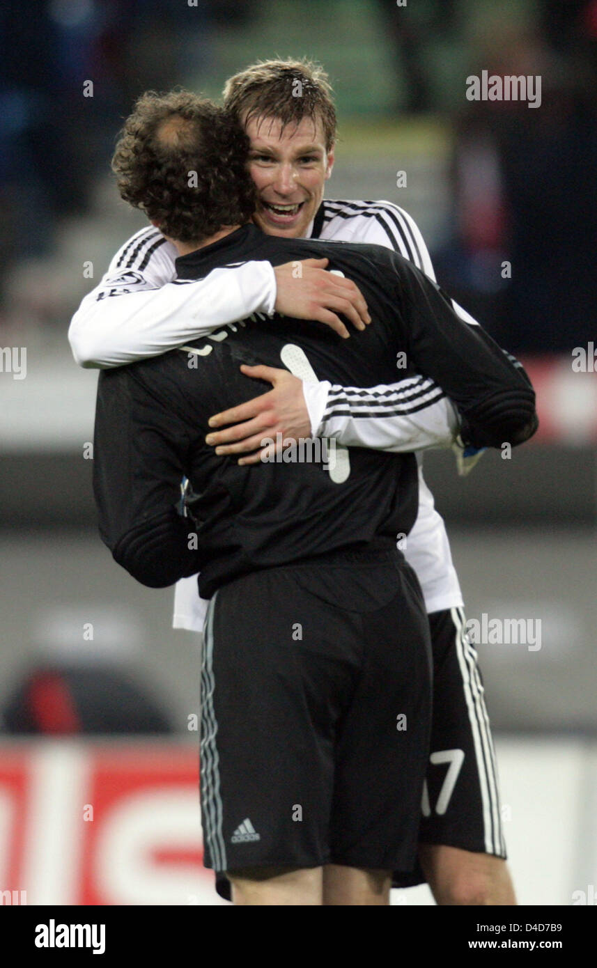 German goalie Jens Lehmann (front) and full-back Per Mertesacker hug after  winning the test cap Switzerland v Germany in Basel, Switzerland, 26 March  2008. Germany defeated the co-host of the UEFA Euro